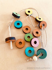 rainbow threading beads: colourful wooden beads for threading and sensory play, designed to encourage fine motor skills and creativity.