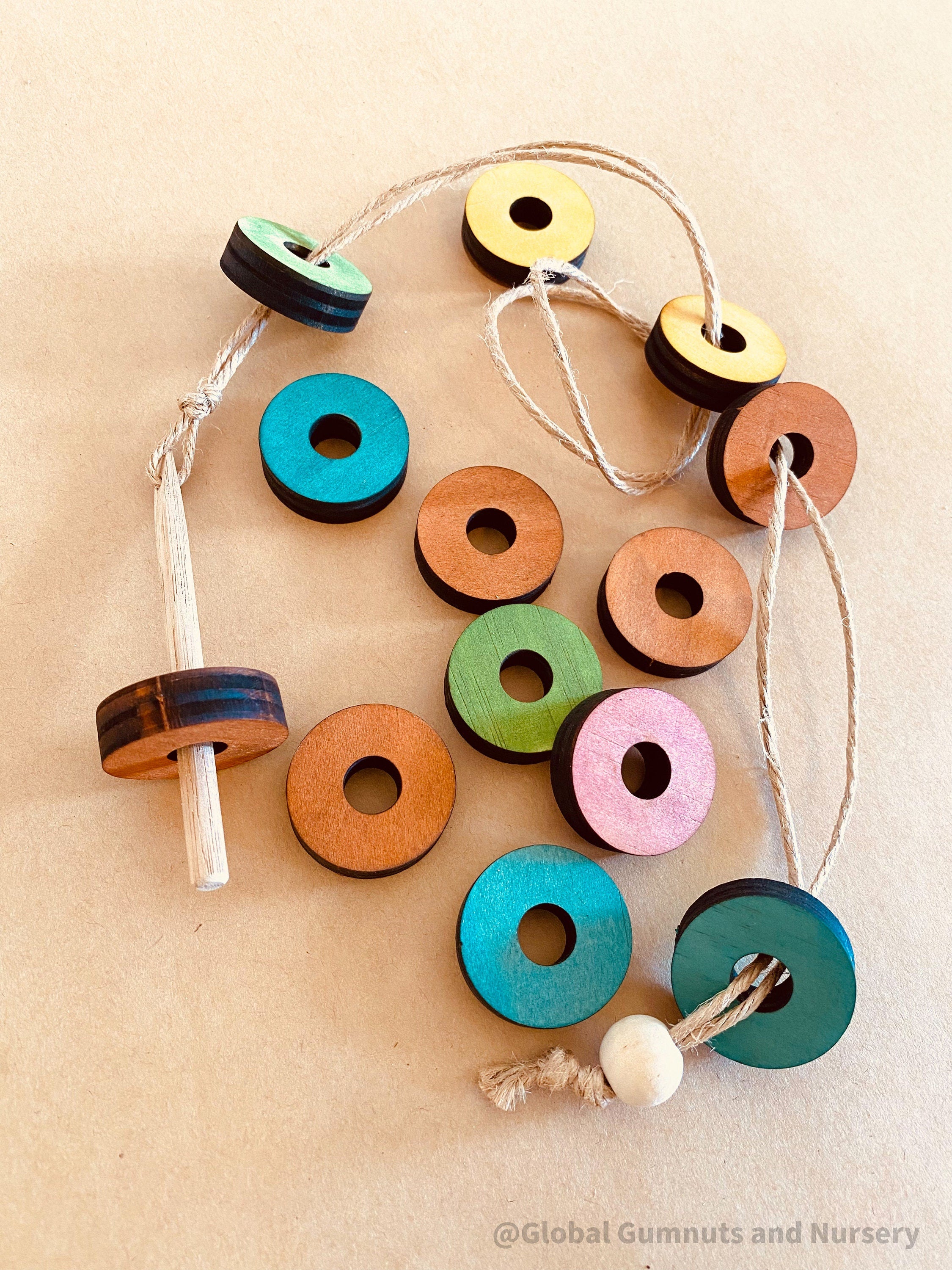 rainbow threading beads: colourful wooden beads for threading and sensory play, designed to encourage fine motor skills and creativity.