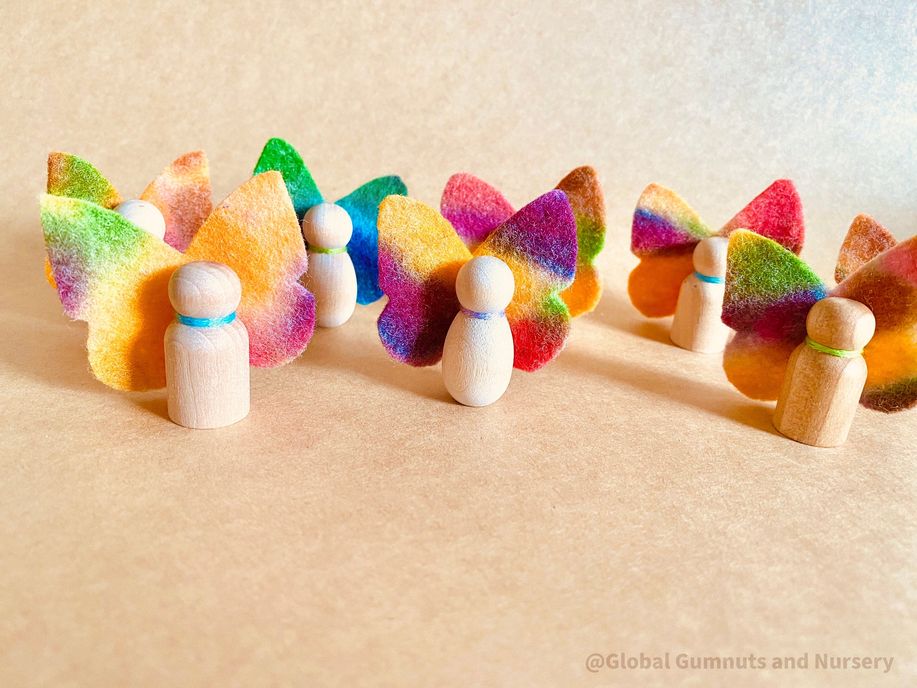 Wool felt butterflies, perfect for play, autumn crafts, or as pocket fairy friends with a wooden body.
