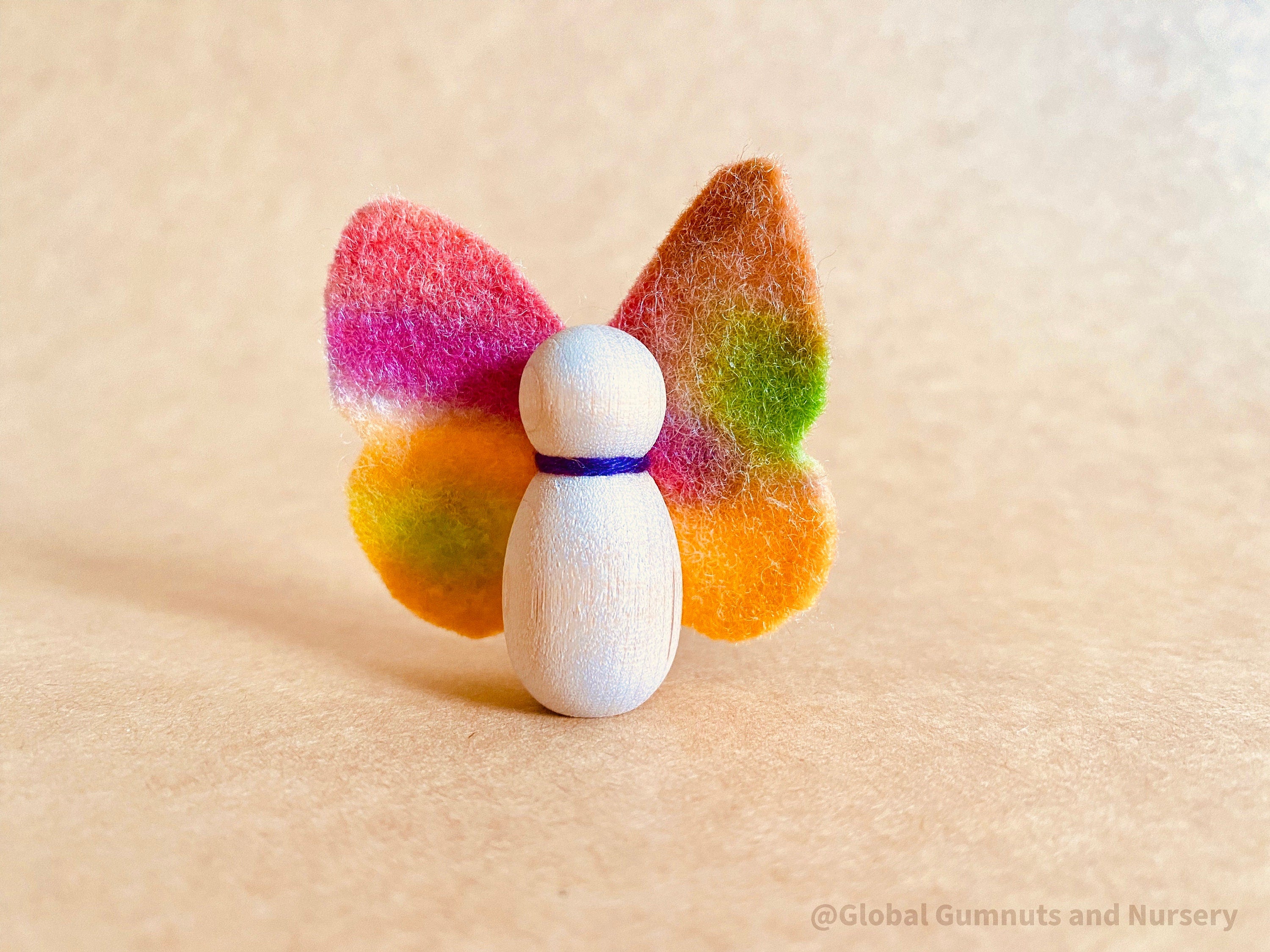 Wool felt butterflies, perfect for play, autumn crafts, or as pocket fairy friends with a wooden body.

