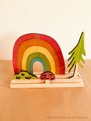 Rainbow Adventure Story Scene: Small world play set with rainbow and weather themes.