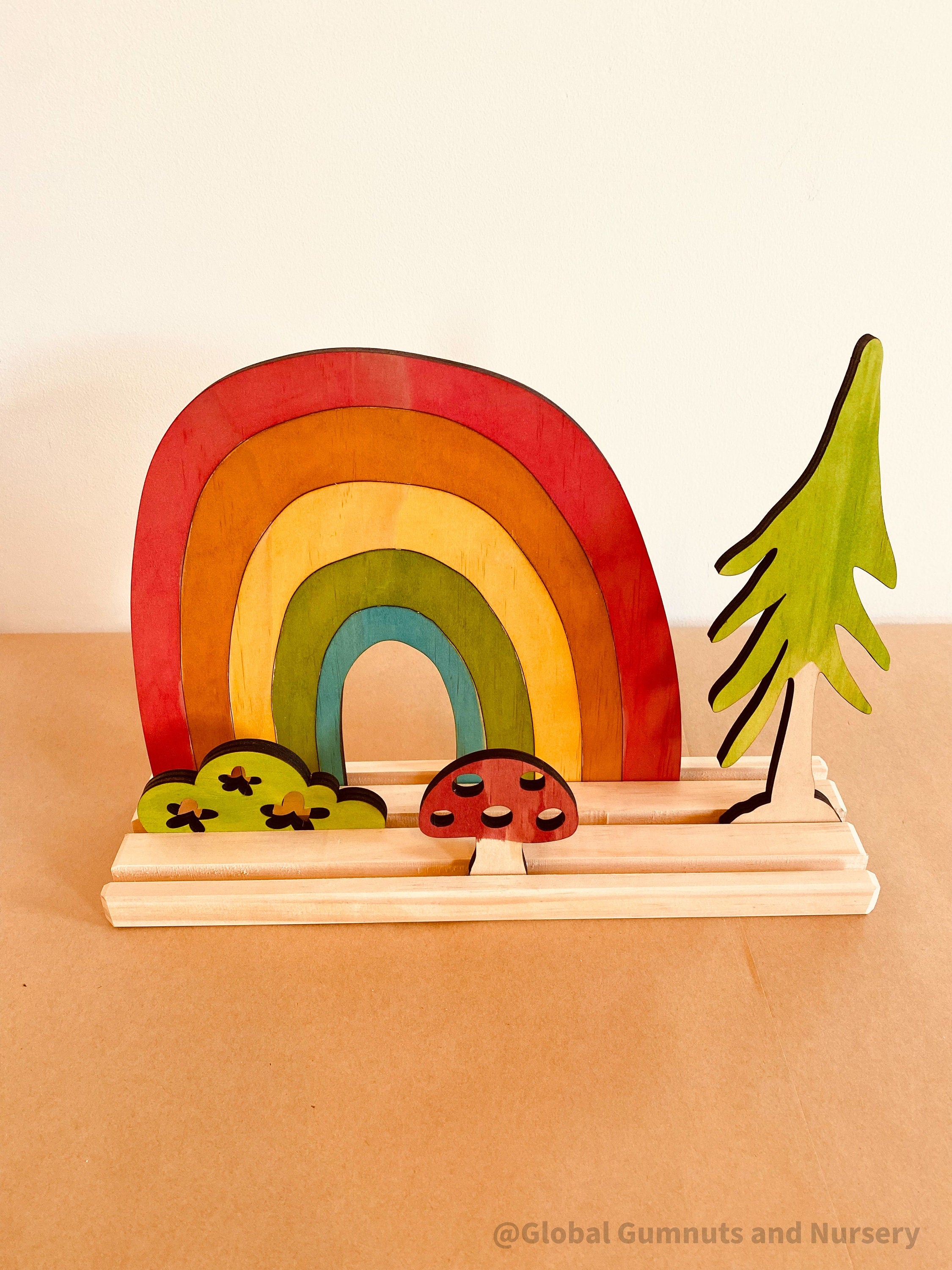 Rainbow Adventure Story Scene: Small world play set with rainbow and weather themes.