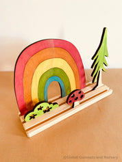 Rainbow Adventure Story Scene: Small world play set with rainbow and weather themes.