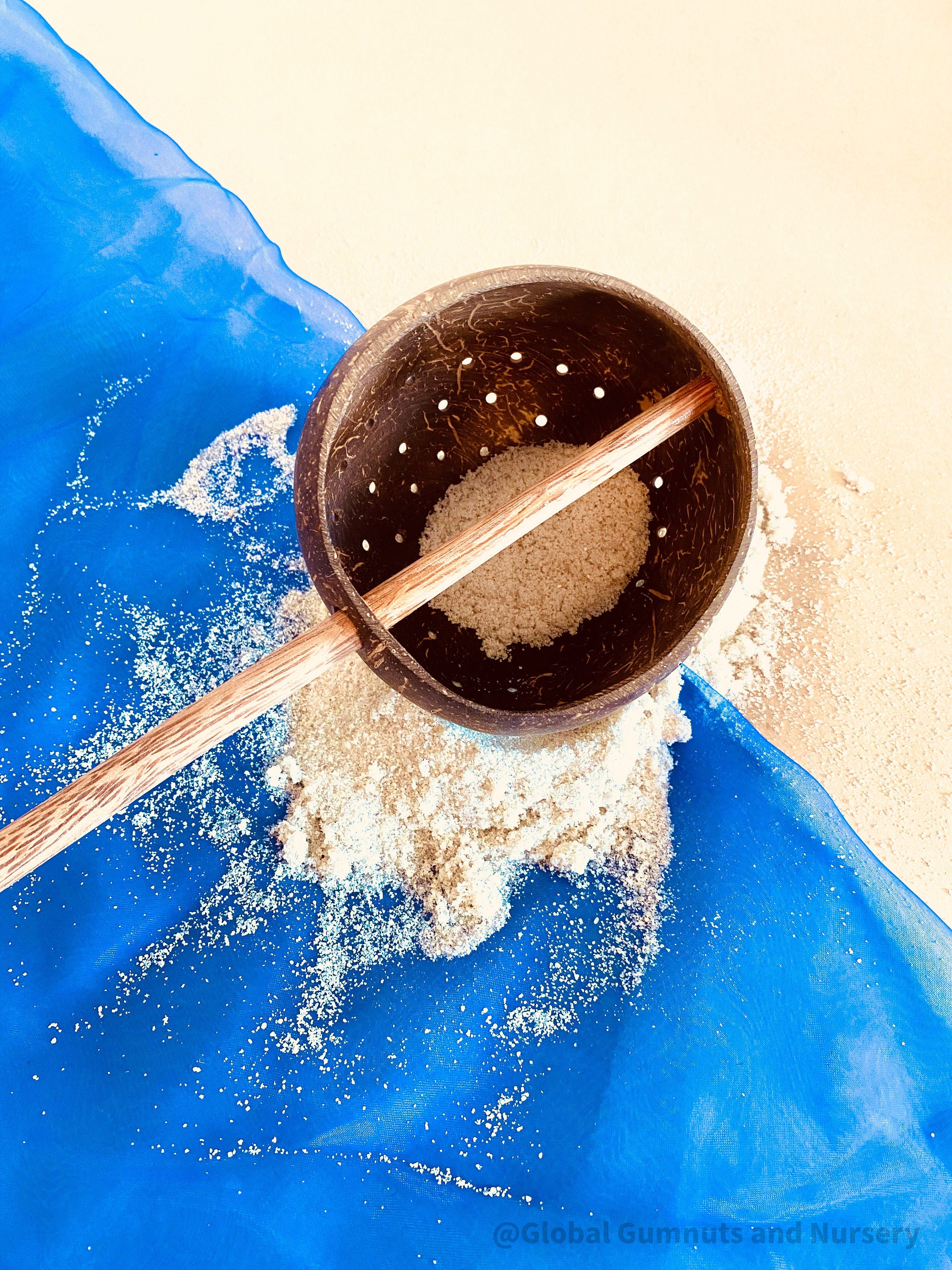 Short handle sand or water scoop, a kid-friendly tool for mud kitchens or play.
