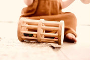 Wooden rainmaker toy in two sizes, a magical sensory and musical toy for kids.