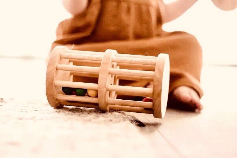 Wooden rainmaker toy in two sizes, a magical sensory and musical toy for kids.