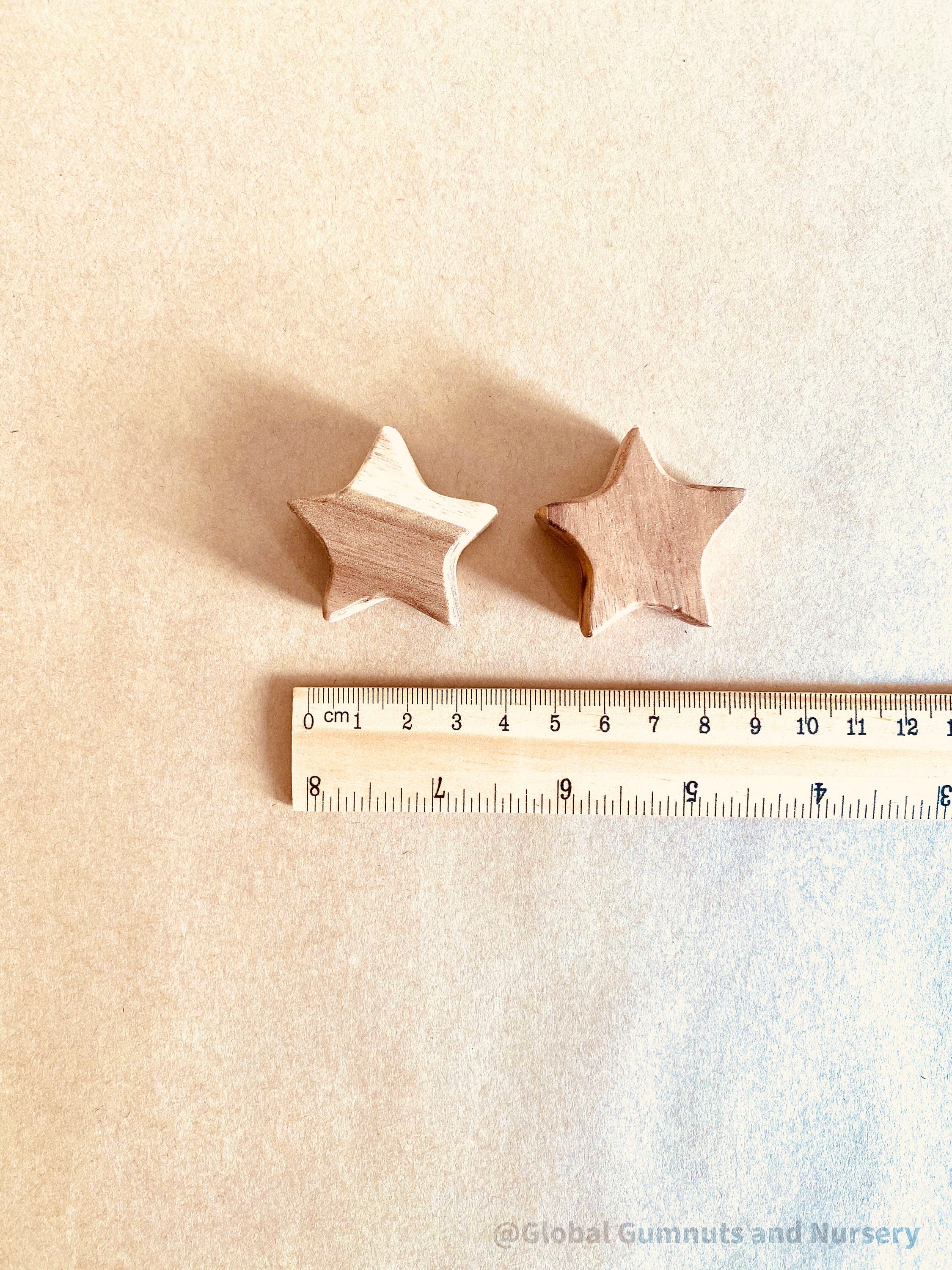 Handmade Wooden Stars: Set of two wooden stars, safe for decor or play.