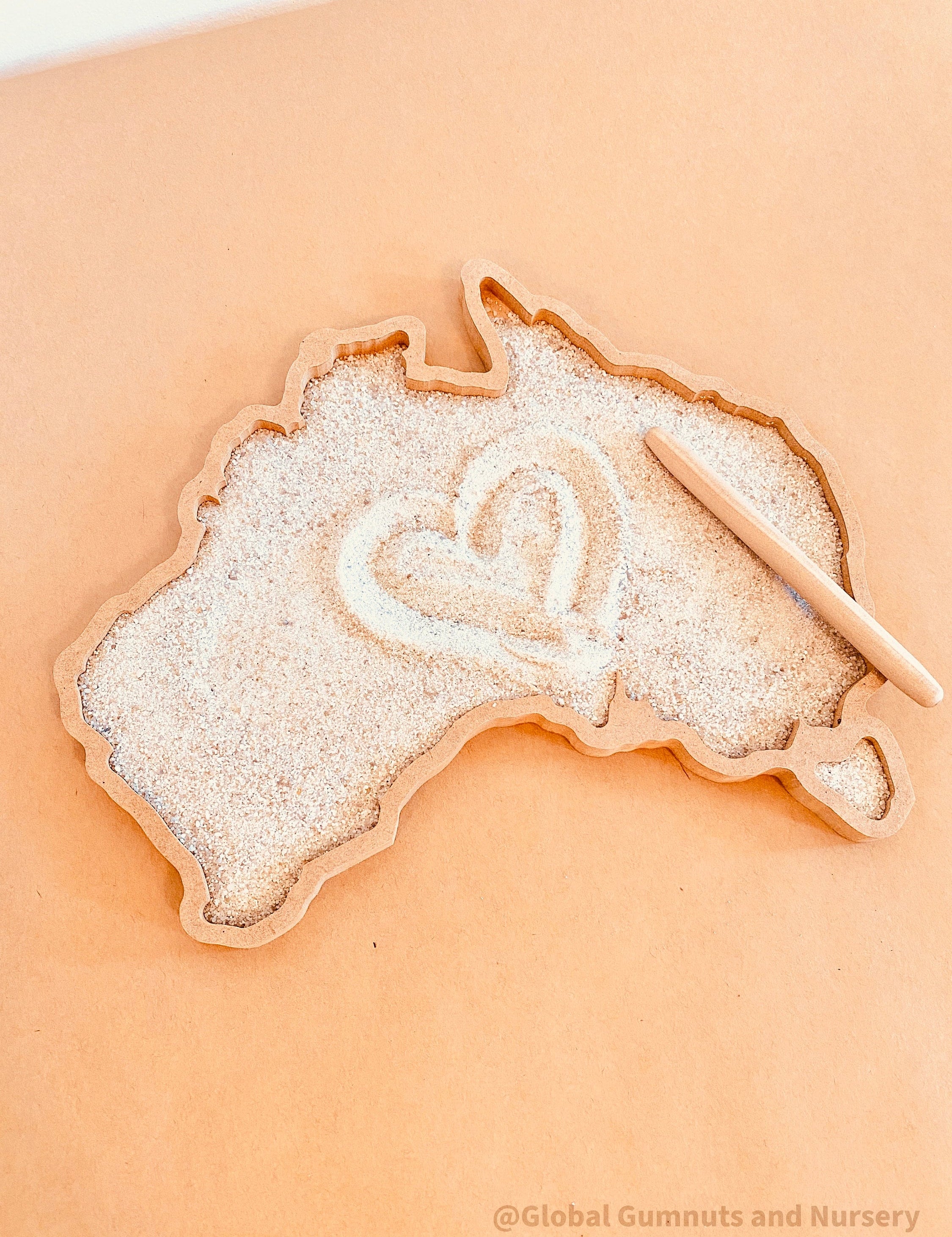 Sensory wonderland with the Australia tray, includes drawing pencil and sand.
