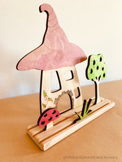 Enchanted Story Scene Set: Fairy garden play set with magical doors and garden elements.