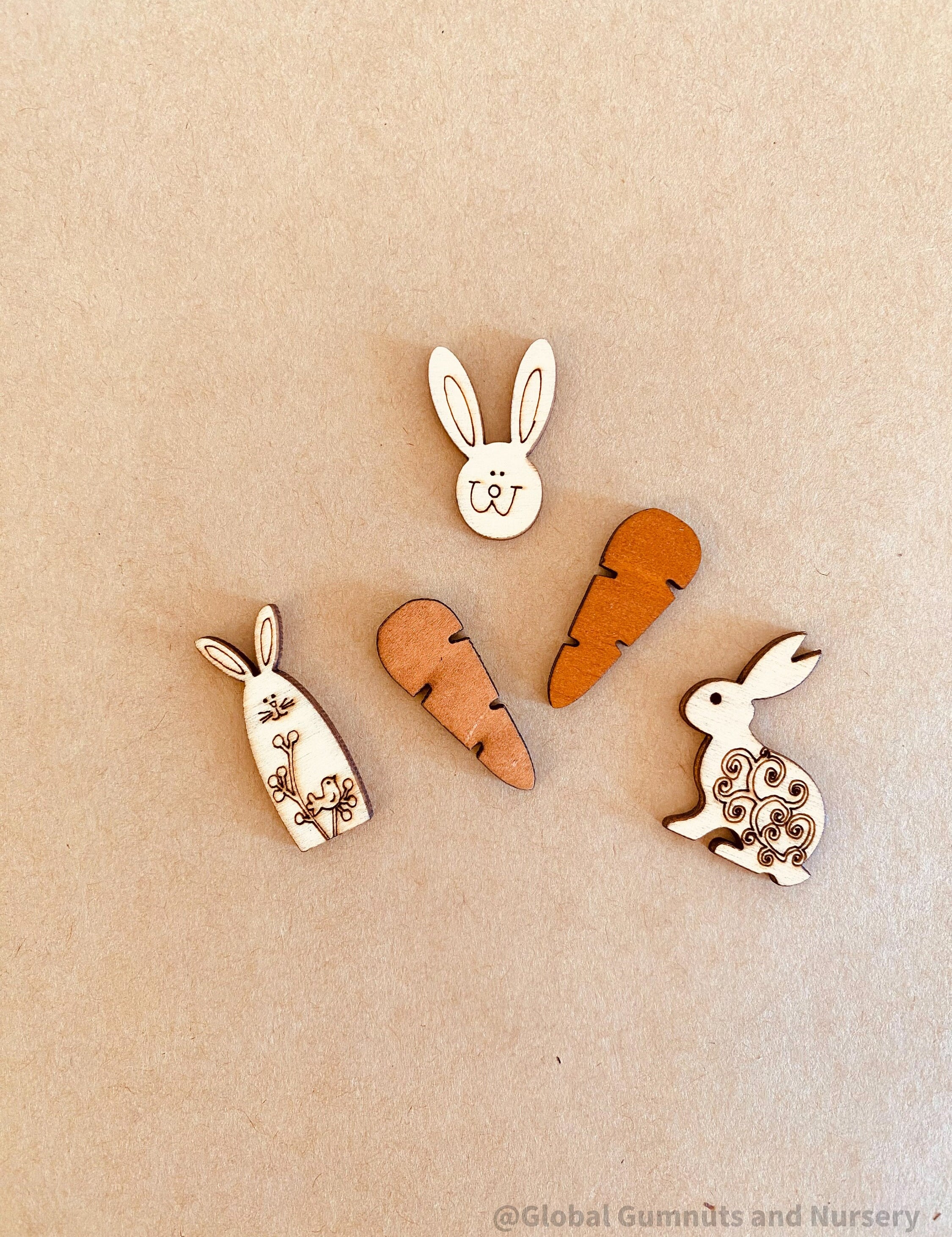 Easter Wooden Embellishments: Set of three bunnies and two carrots for Easter-themed crafts.