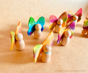 Wool felt butterflies, perfect for play, autumn crafts, or as pocket fairy friends with a wooden body.

