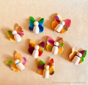 Wool felt butterflies, perfect for play, autumn crafts, or as pocket fairy friends with a wooden body.
