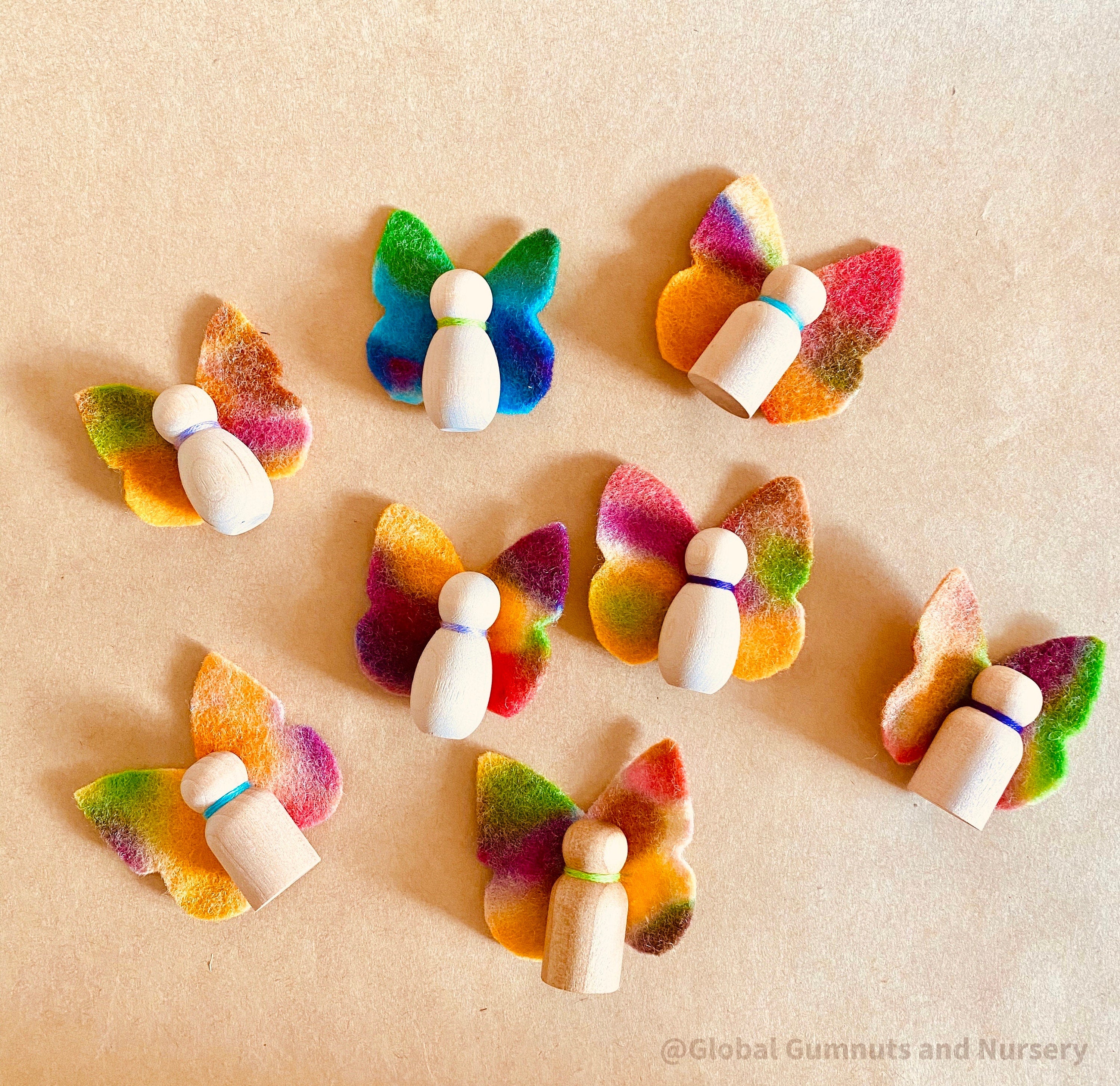Wool felt butterflies, perfect for play, autumn crafts, or as pocket fairy friends with a wooden body.
