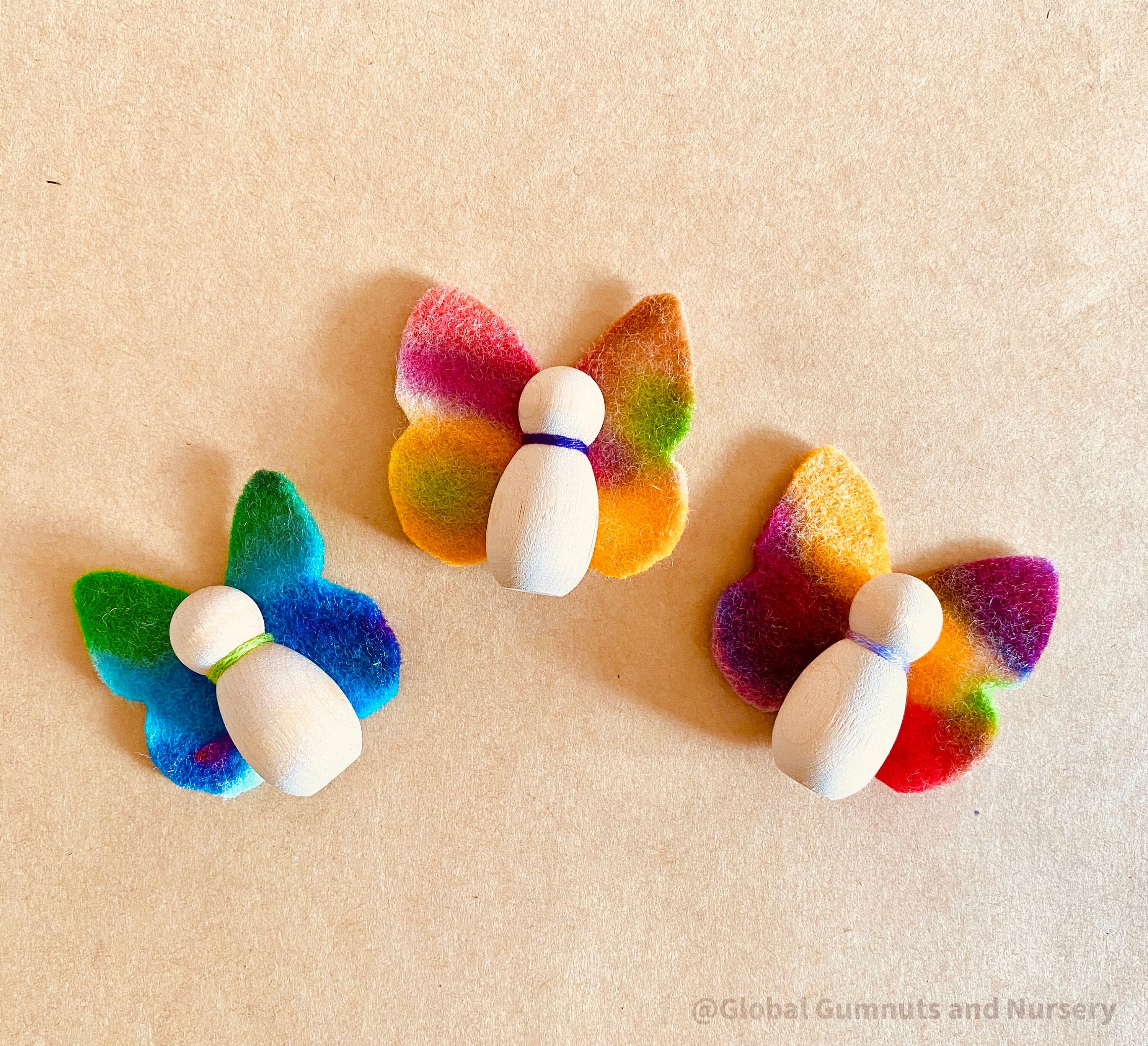 Wool felt butterflies, perfect for play, autumn crafts, or as pocket fairy friends with a wooden body.

