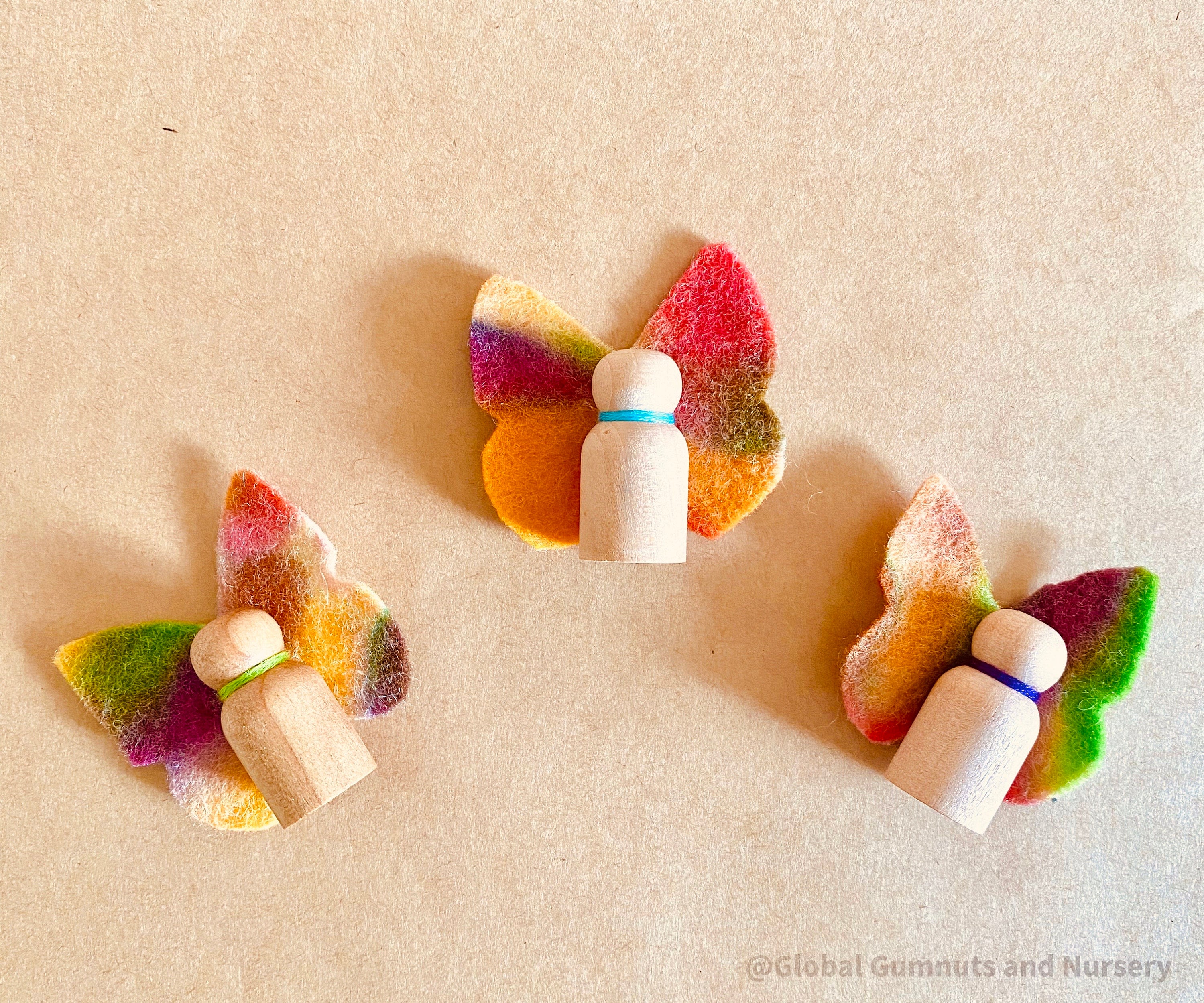 Wool felt butterflies, perfect for play, autumn crafts, or as pocket fairy friends with a wooden body.
