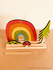 Rainbow Adventure Story Scene: Small world play set with rainbow and weather themes.