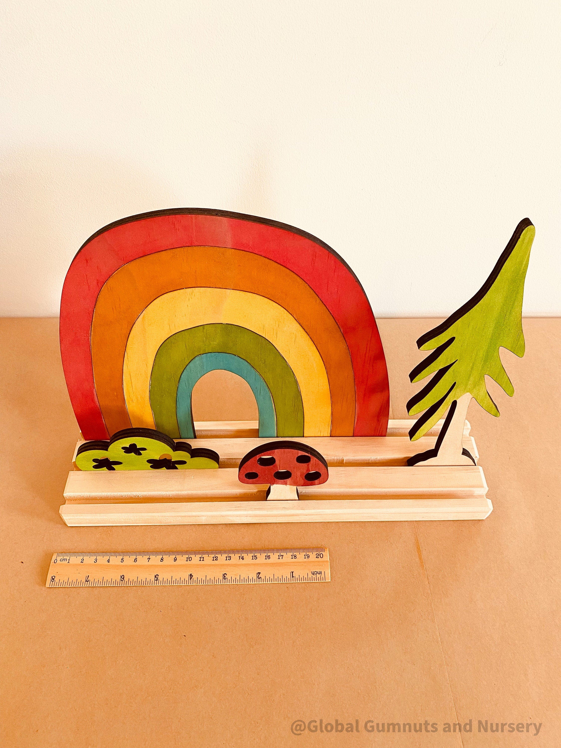 Rainbow Adventure Story Scene: Small world play set with rainbow and weather themes.