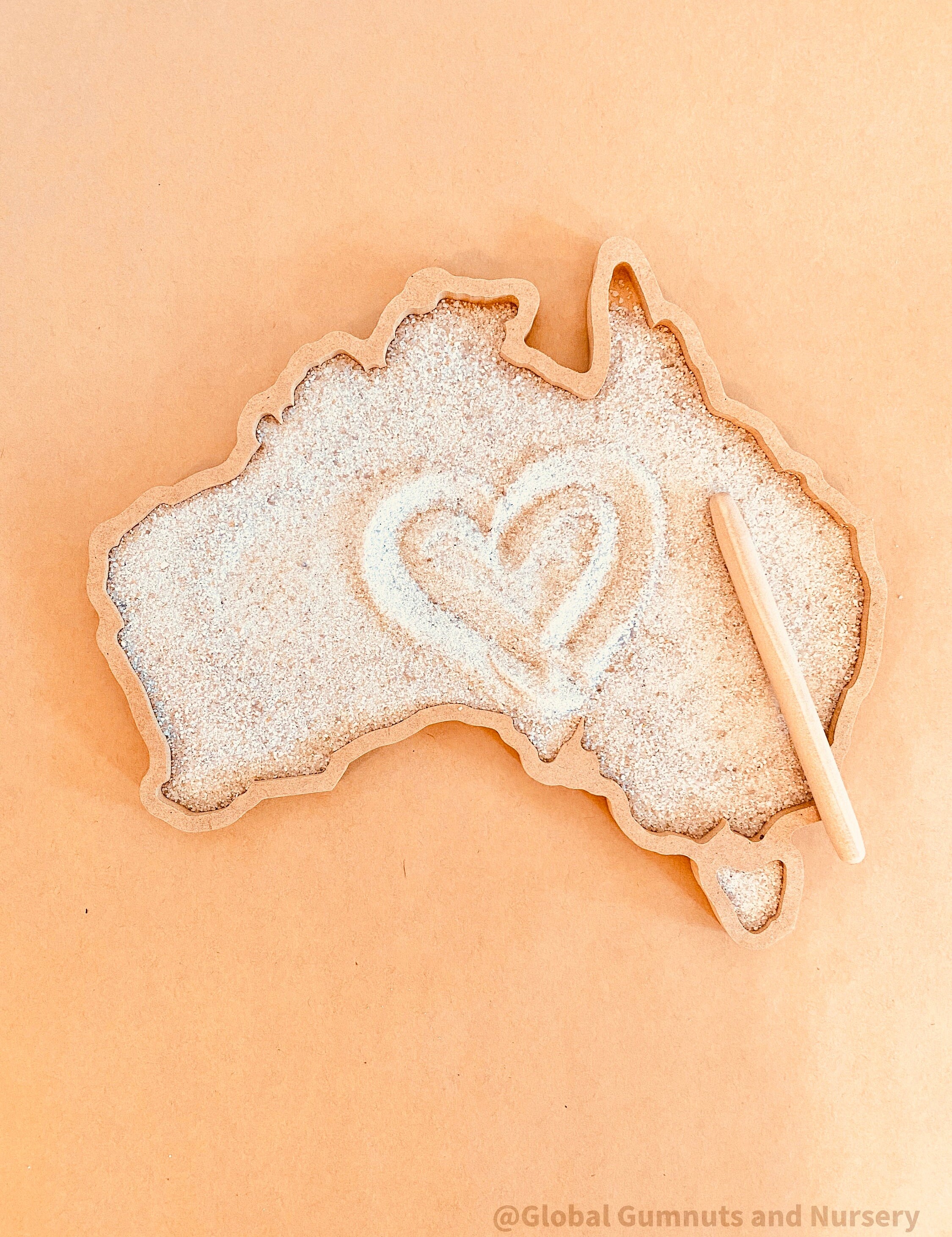 Sensory wonderland with the Australia tray, includes drawing pencil and sand.