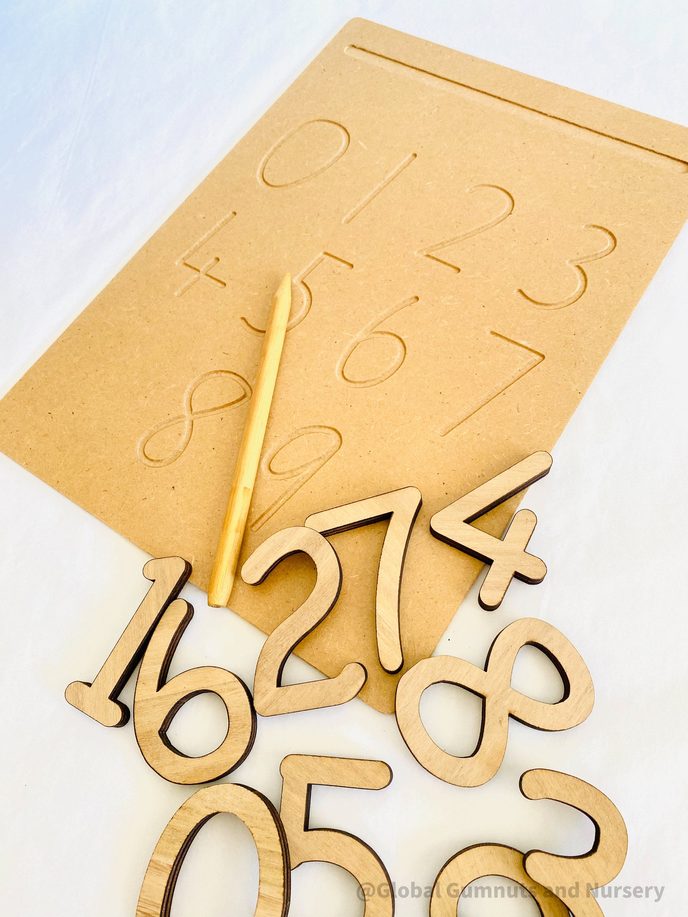 NUMBERS 0-9 Tracing Board: Montessori-style wooden tracing board with a stylus, helping children learn to trace and recognize numbers.