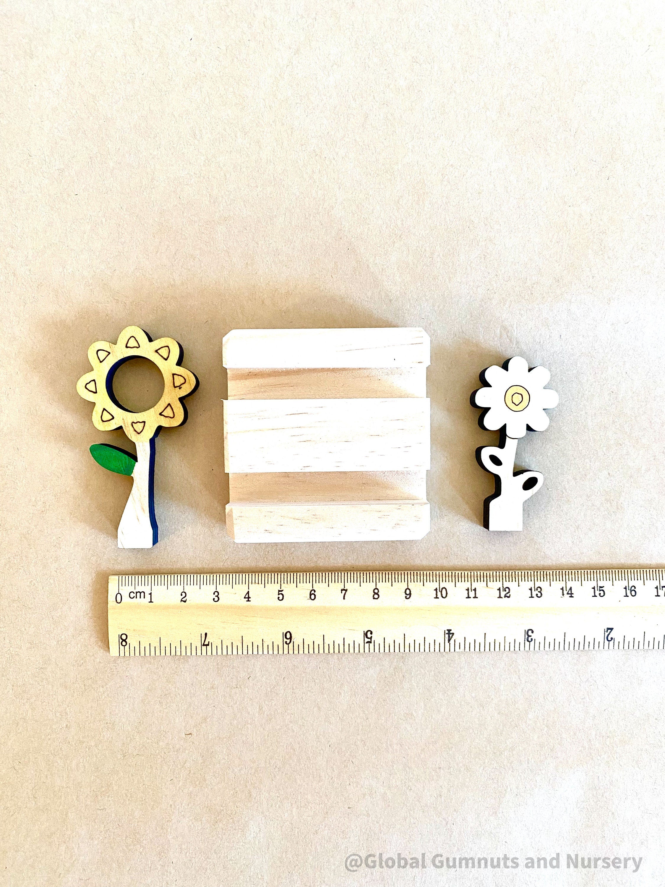 Mini Flower Display with Stand: Floral decor with a stand for small-world scenes and displays.