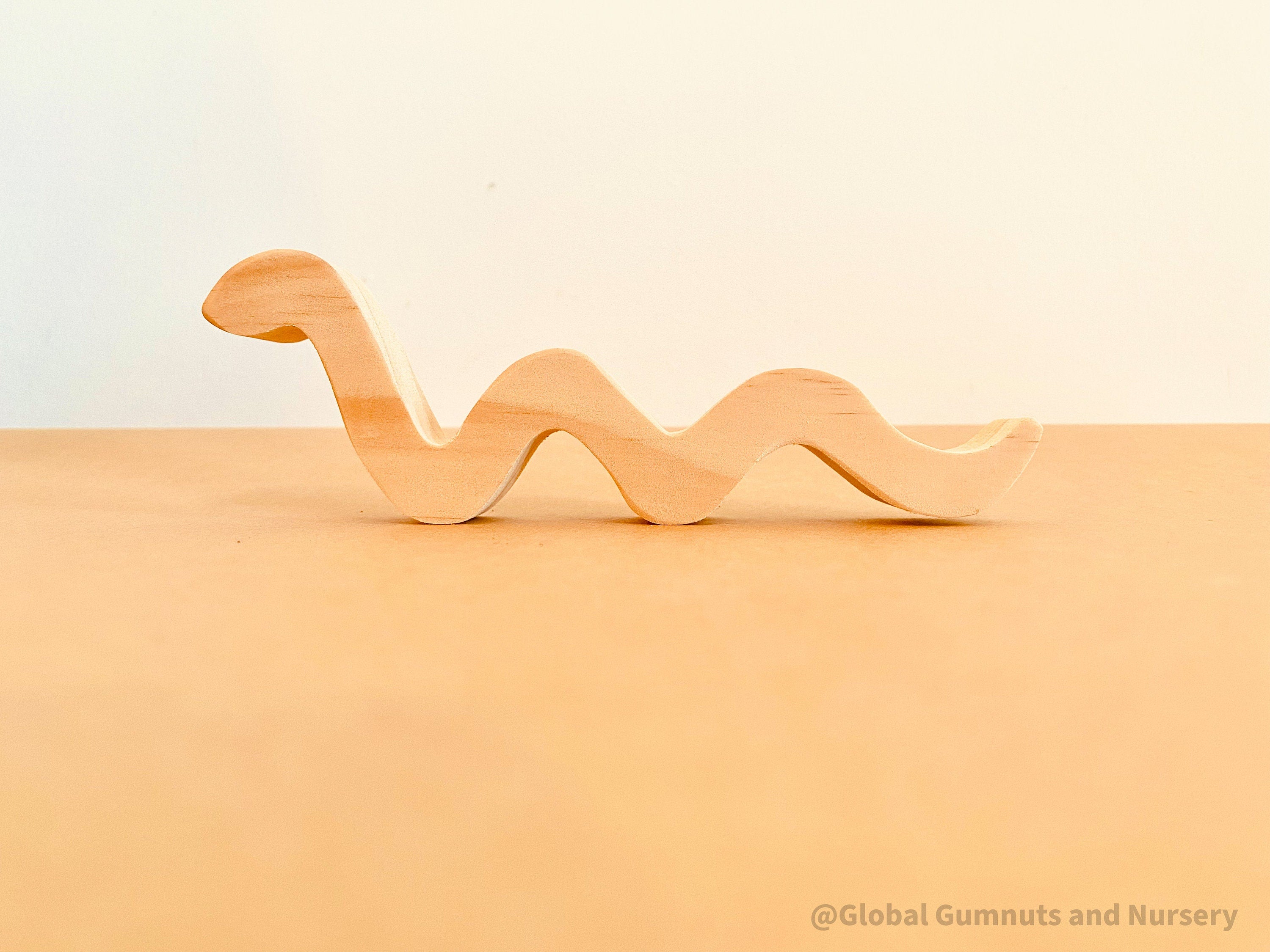 Handmade Raw Pine Wooden Snakes: Wooden snakes crafted from raw pine for creative play.