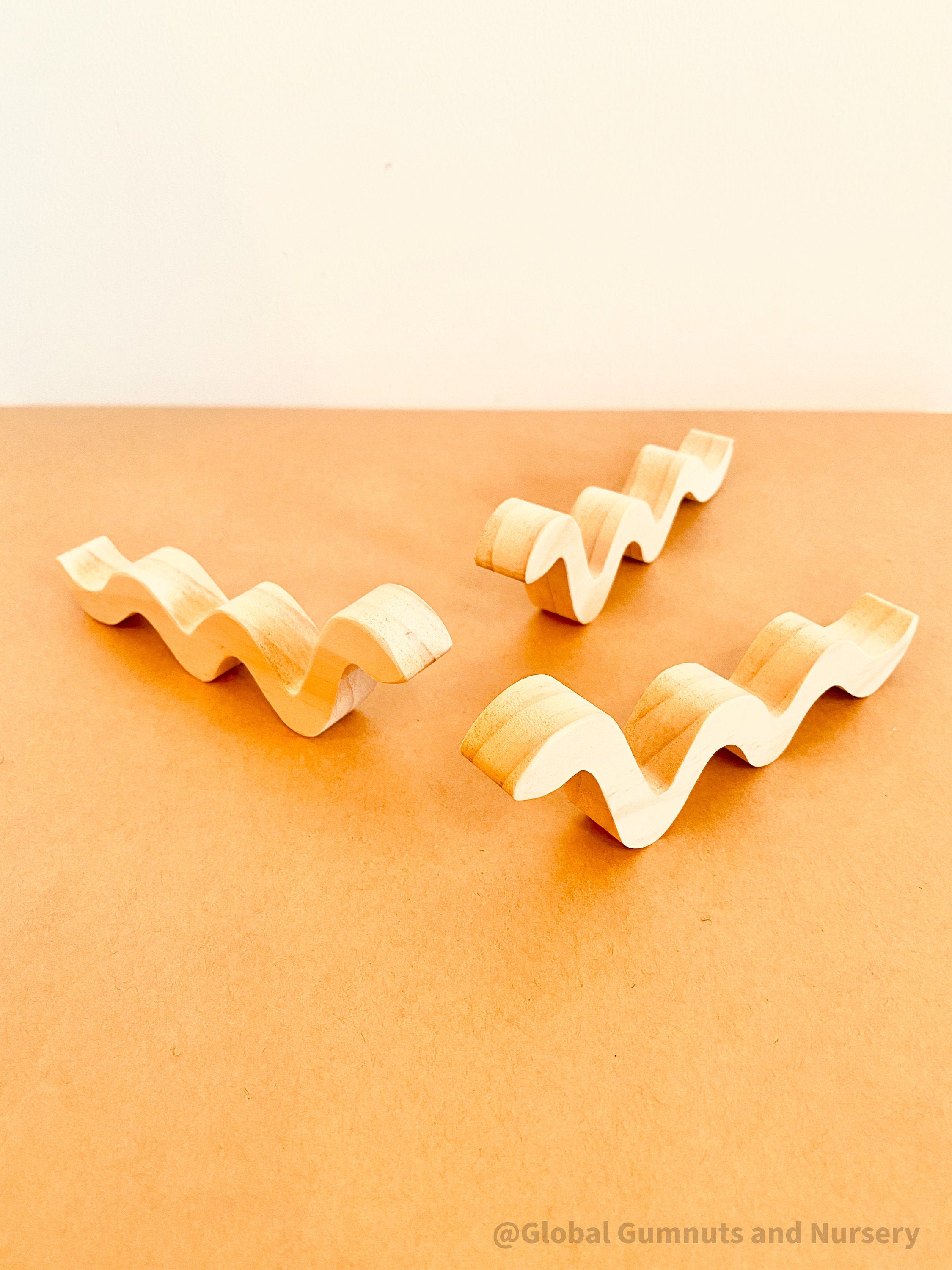 Handmade Raw Pine Wooden Snakes: Wooden snakes crafted from raw pine for creative play.