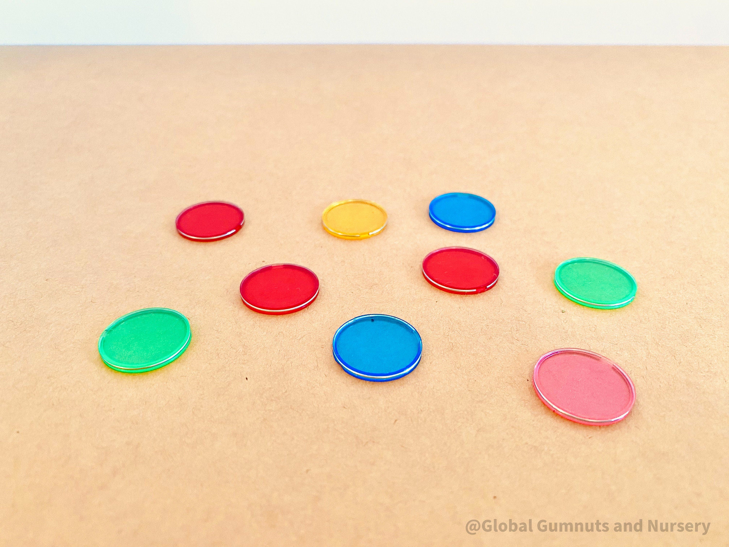 Magnetic colored chips/tiles, a fun and versatile addition to magnetic play or learning activities.