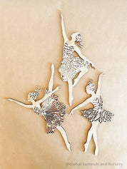 Set of three wooden ballerinas with rose gold backing, elegant wall decor for girls' bedrooms.
