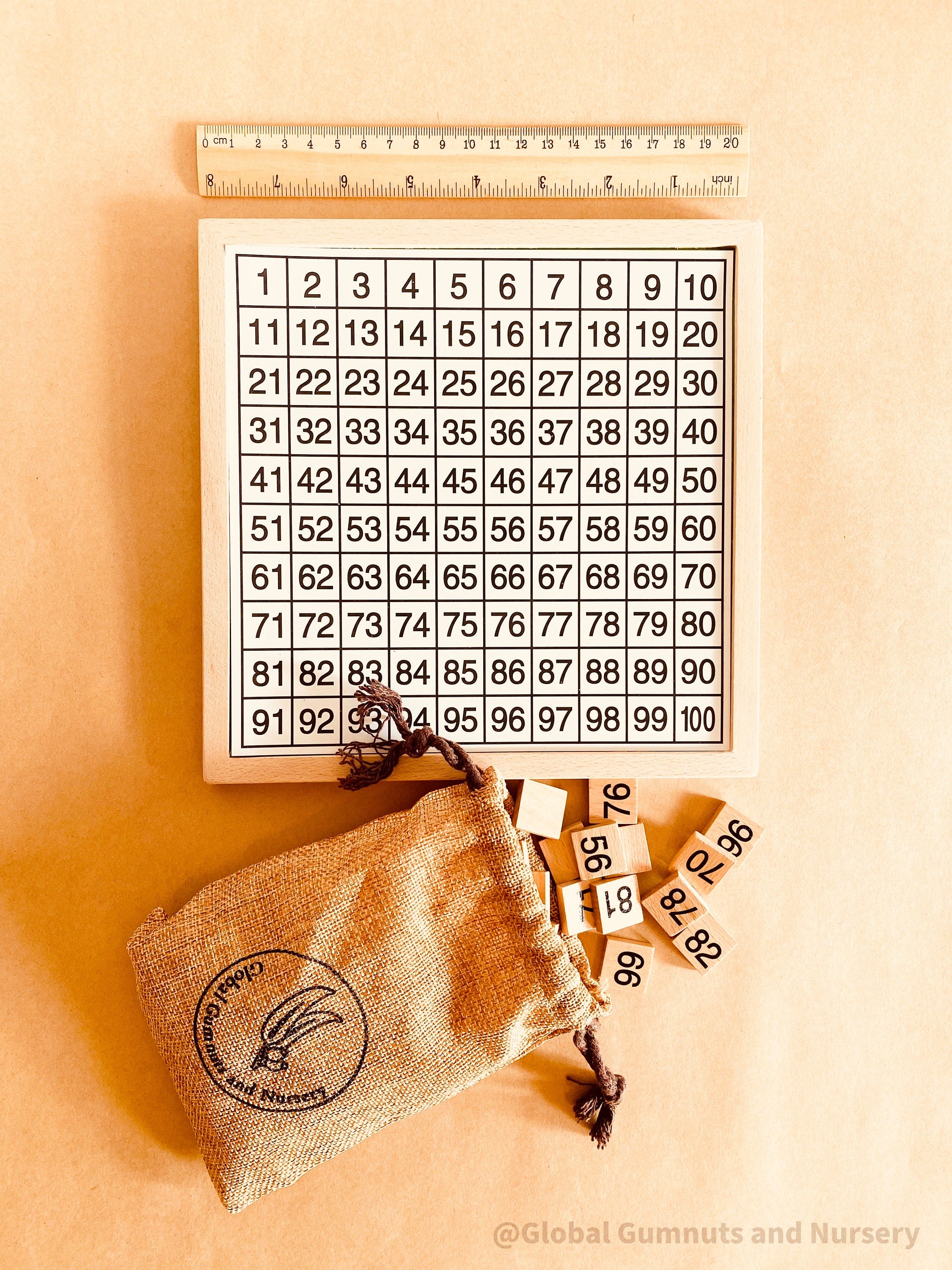Wooden number board featuring numbers 1-100, perfect for teaching counting, times tables, and number recognition. A fun Montessori-style educational tool for kids.