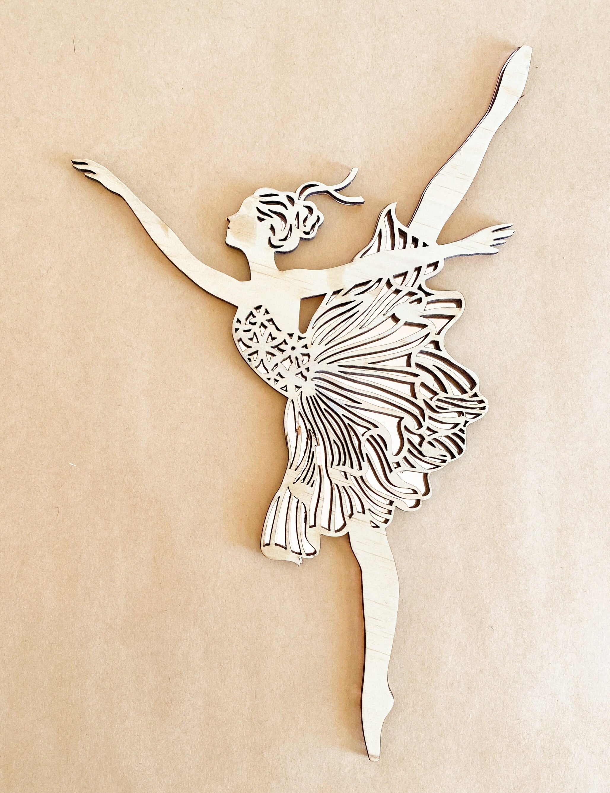 Set of three wooden ballerinas with rose gold backing, elegant wall decor for girls' bedrooms.