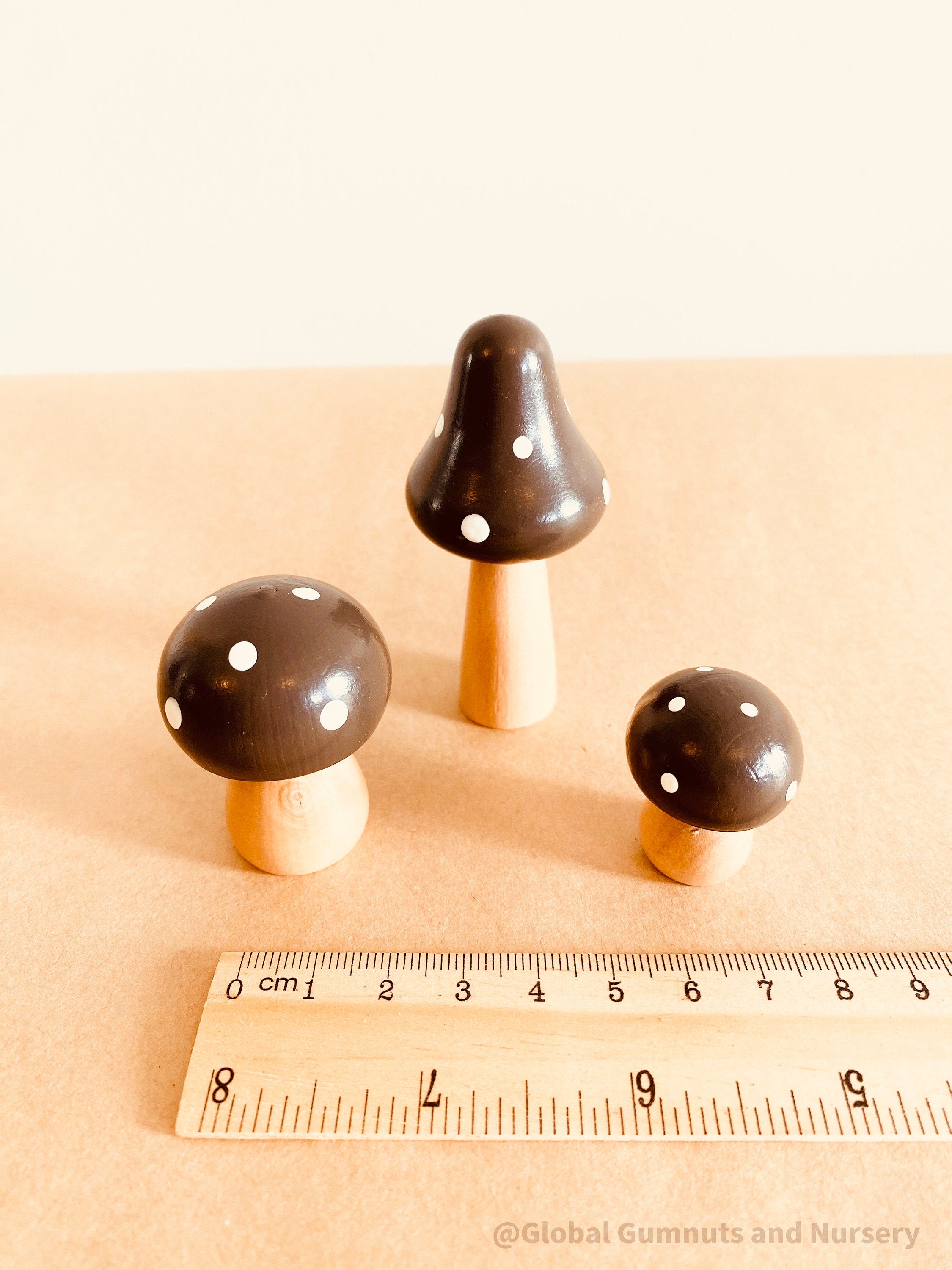Fairy garden wooden mushrooms, handcrafted for magical small-world setups or Christmas elf displays.