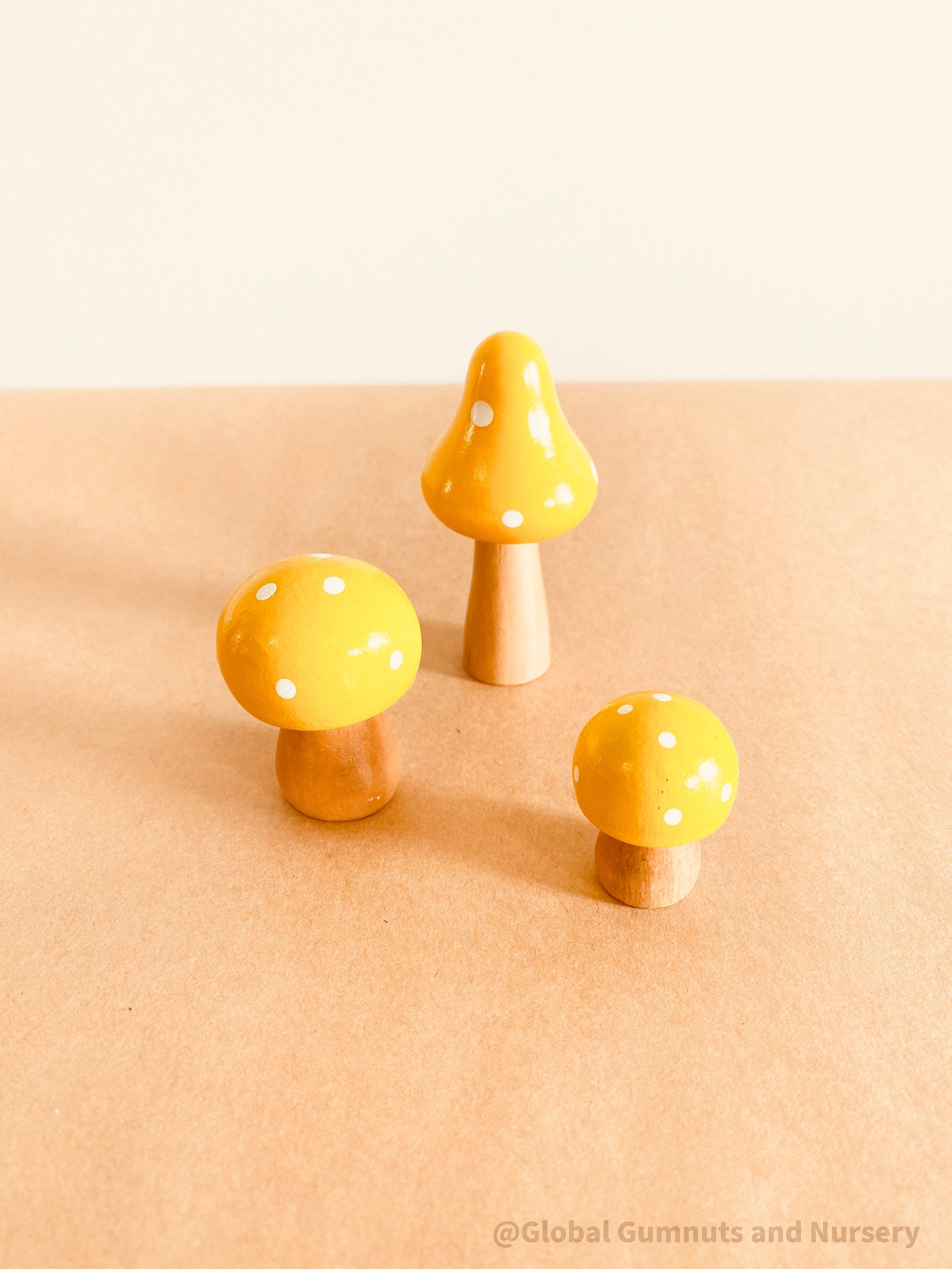 Fairy garden wooden mushrooms, handcrafted for magical small-world setups or Christmas elf displays.