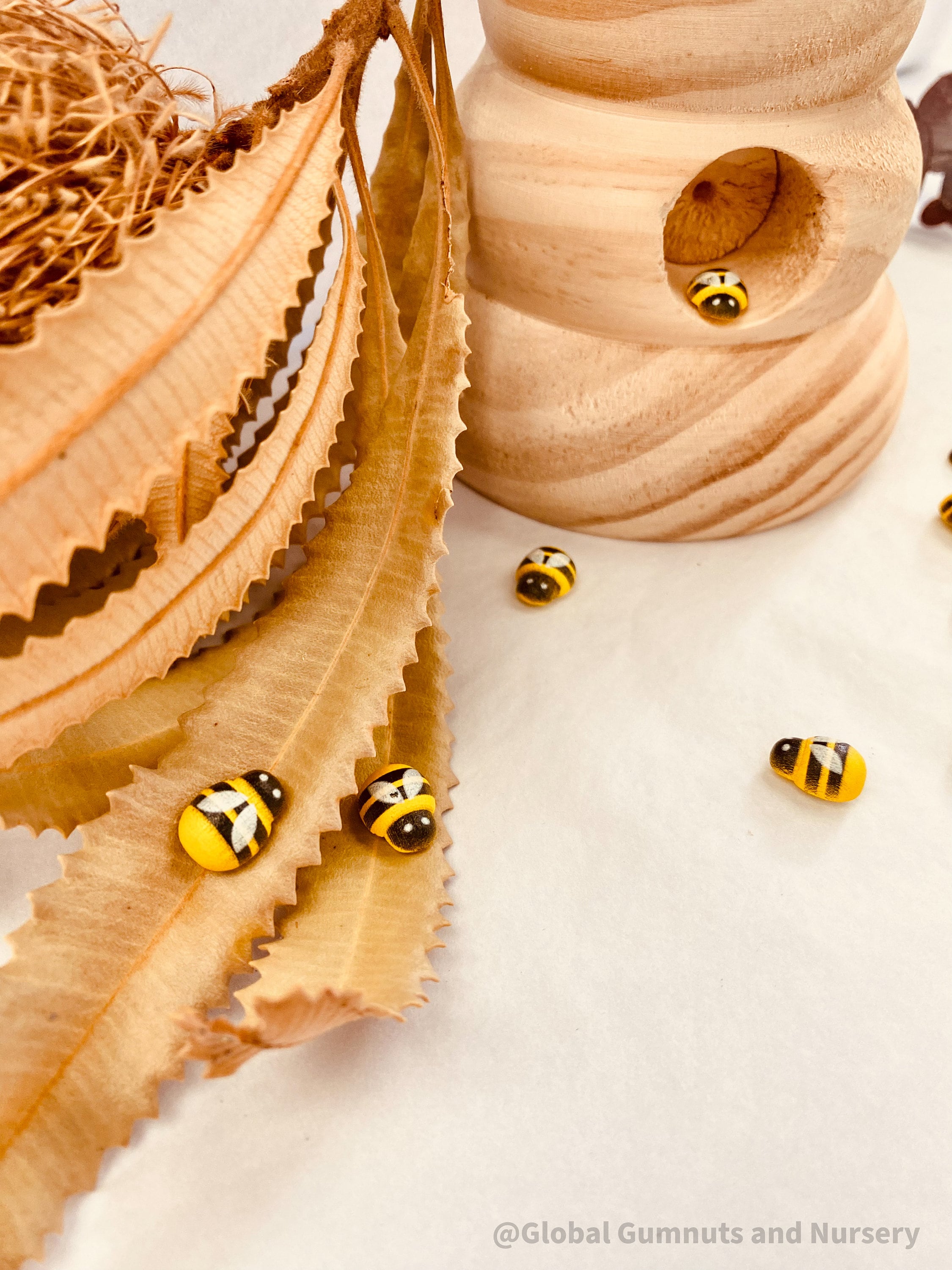 Mini Wooden Bees: Small wooden bee figurines for creative play.