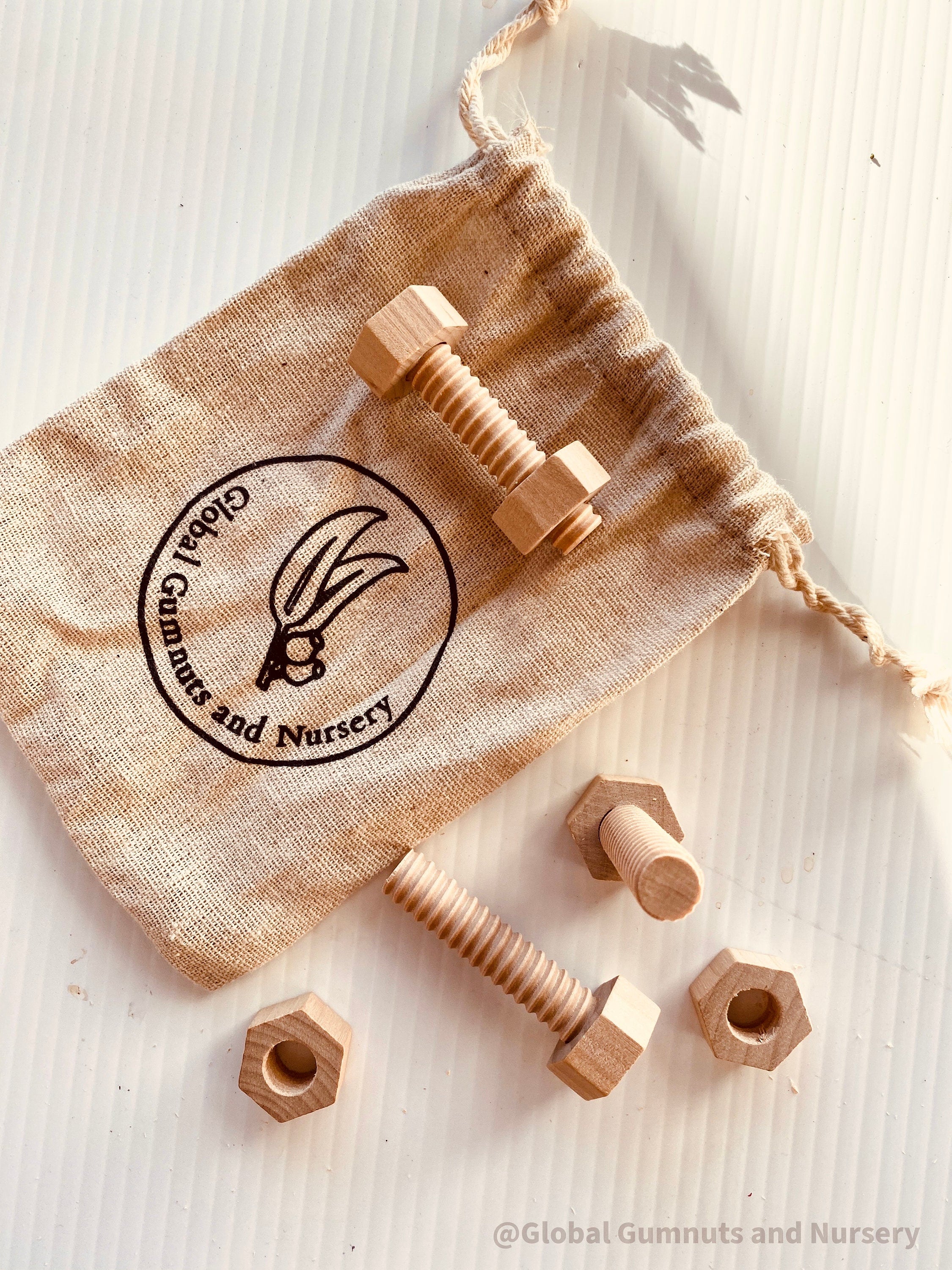 Wooden Nuts & Bolts Set: Six-piece set for motor skill development through play.