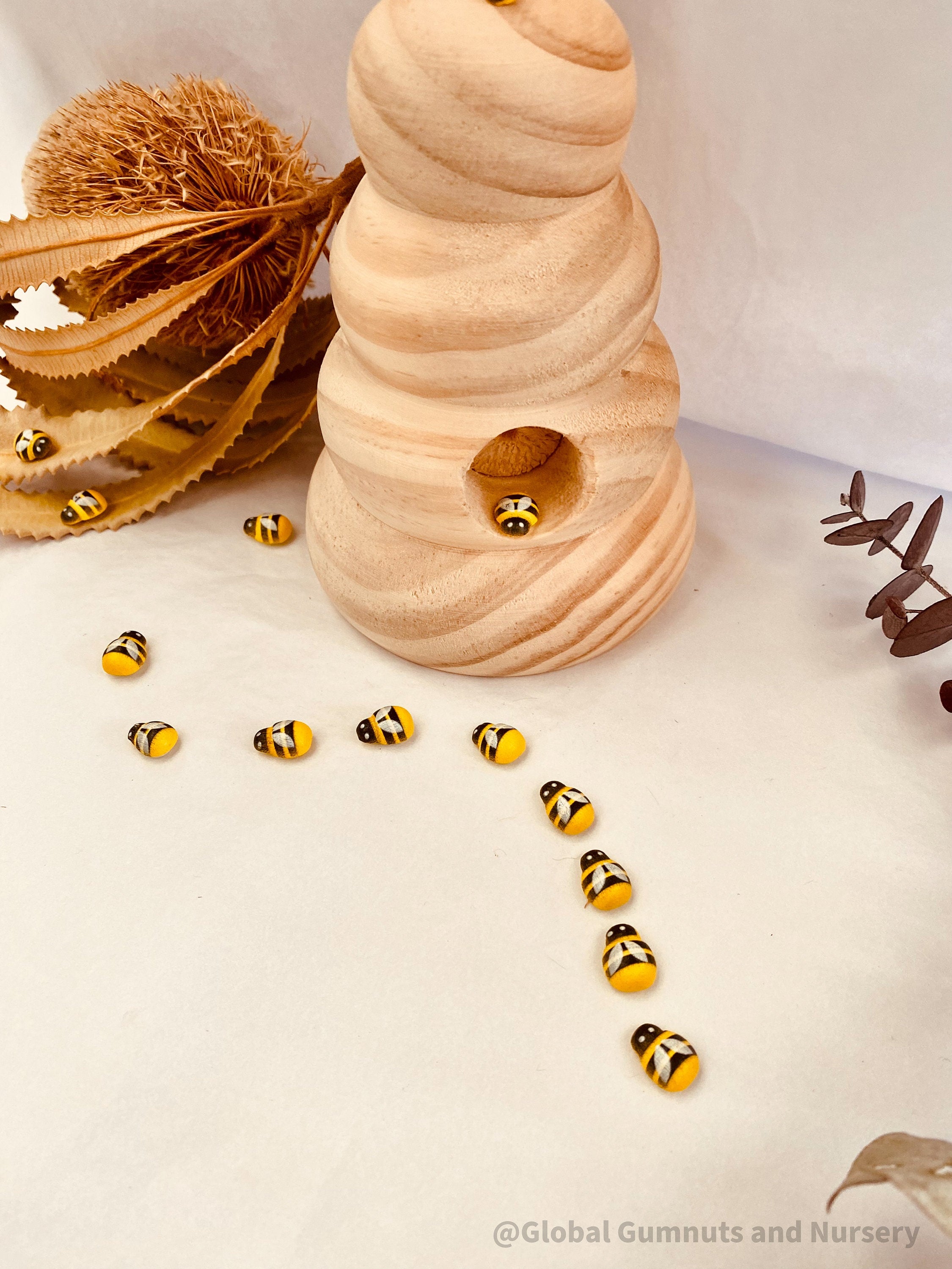 Mini Wooden Bees: Small wooden bee figurines for creative play.