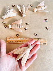 Hand-Carved Wooden Bees: Large wooden bees for life cycle learning.