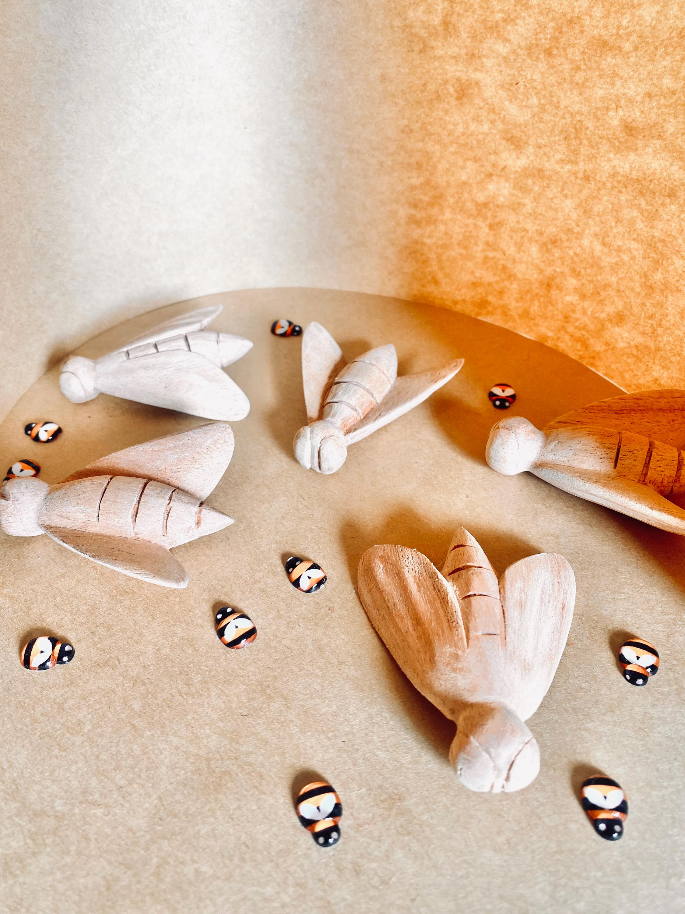 Hand-Carved Wooden Bees: Large wooden bees for life cycle learning.