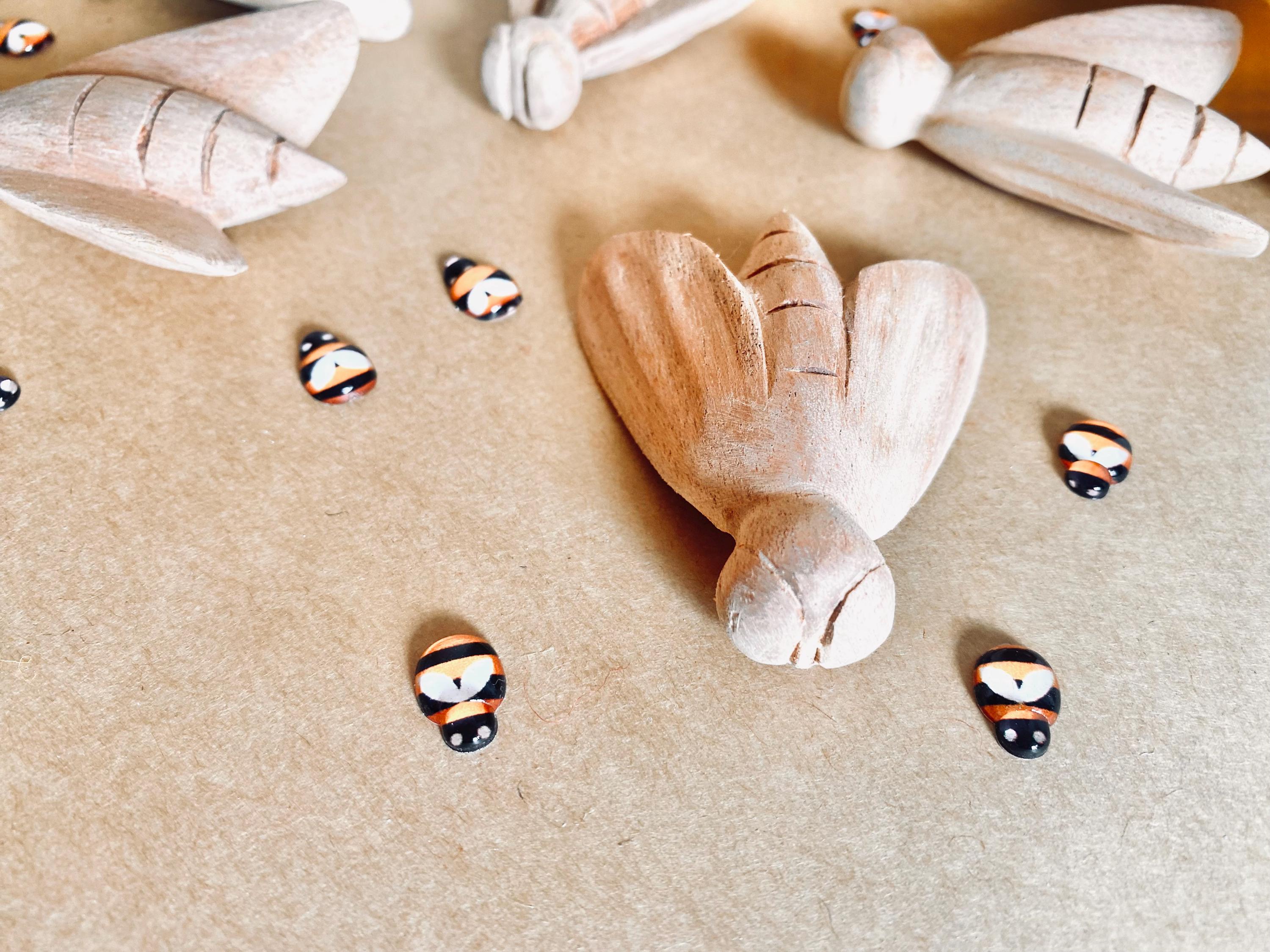 Hand-Carved Wooden Bees: Large wooden bees for life cycle learning.