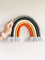 Chunky macrame boho rainbow wall hanging, ideal for brightening up a nursery or adding vibrant decor to any space.