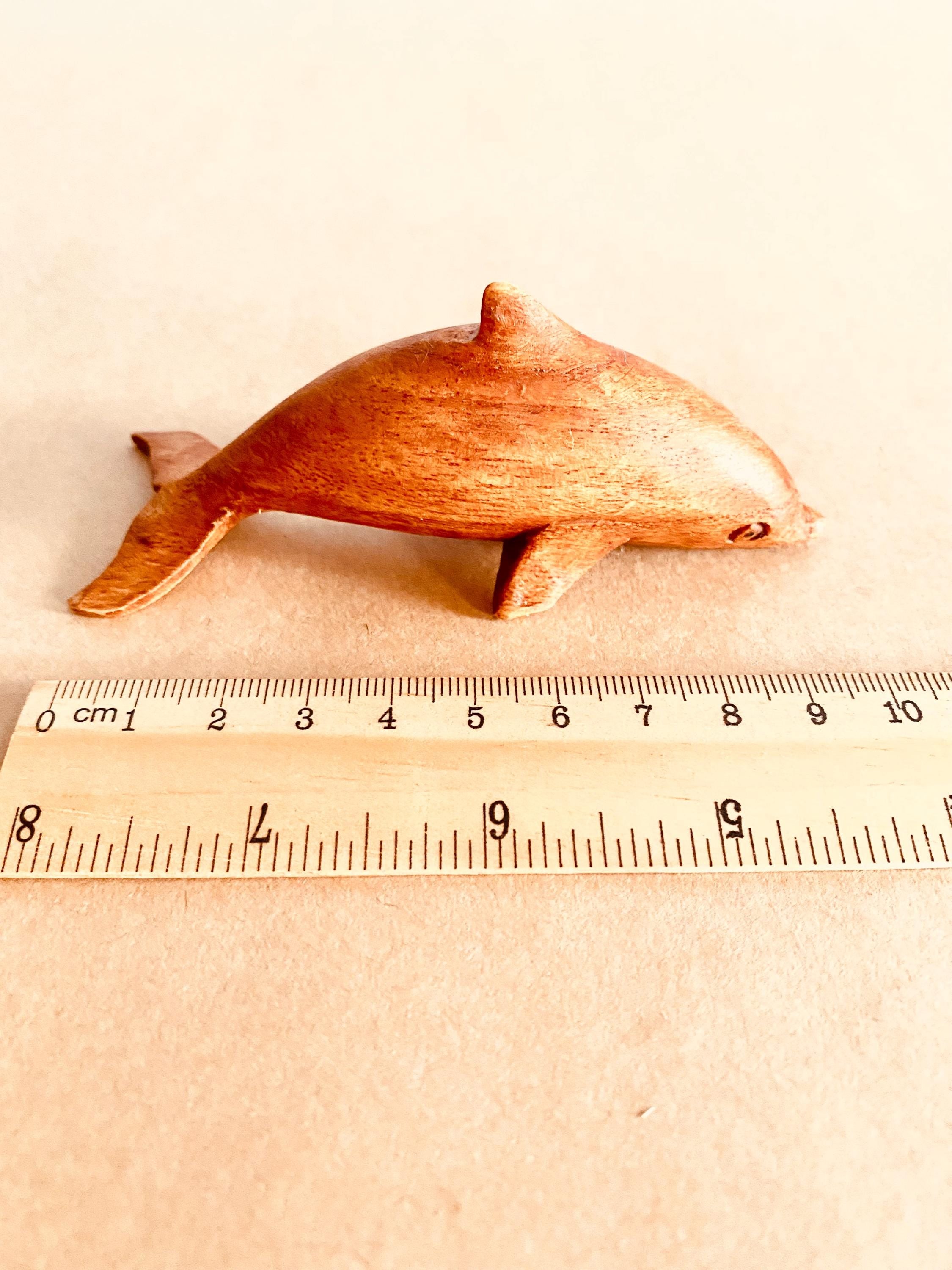 Eco-friendly 11cm wooden dolphin figurine, perfect as sustainable decor or a playful toy.