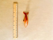 Eco-friendly 11cm wooden dolphin figurine, perfect as sustainable decor or a playful toy.