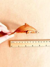 Eco-friendly 11cm wooden dolphin figurine, perfect as sustainable decor or a playful toy.