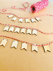 Miniature Wooden Garland with Twine: Small wooden garland with red and white twine for dollhouses or fairy gardens.
