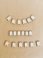 Miniature Wooden Garland with Twine: Small wooden garland with red and white twine for dollhouses or fairy gardens.