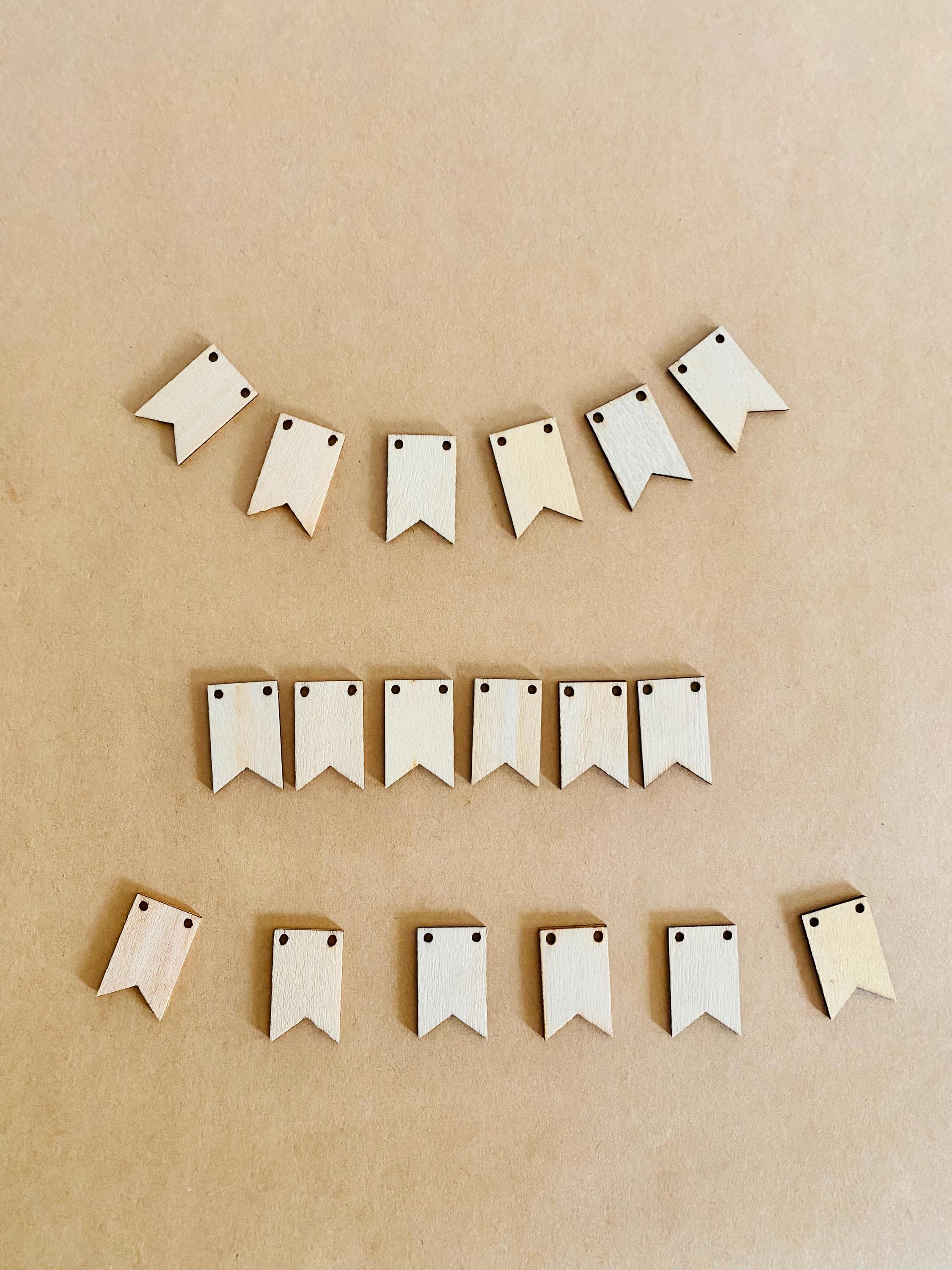 Miniature Wooden Garland with Twine: Small wooden garland with red and white twine for dollhouses or fairy gardens.