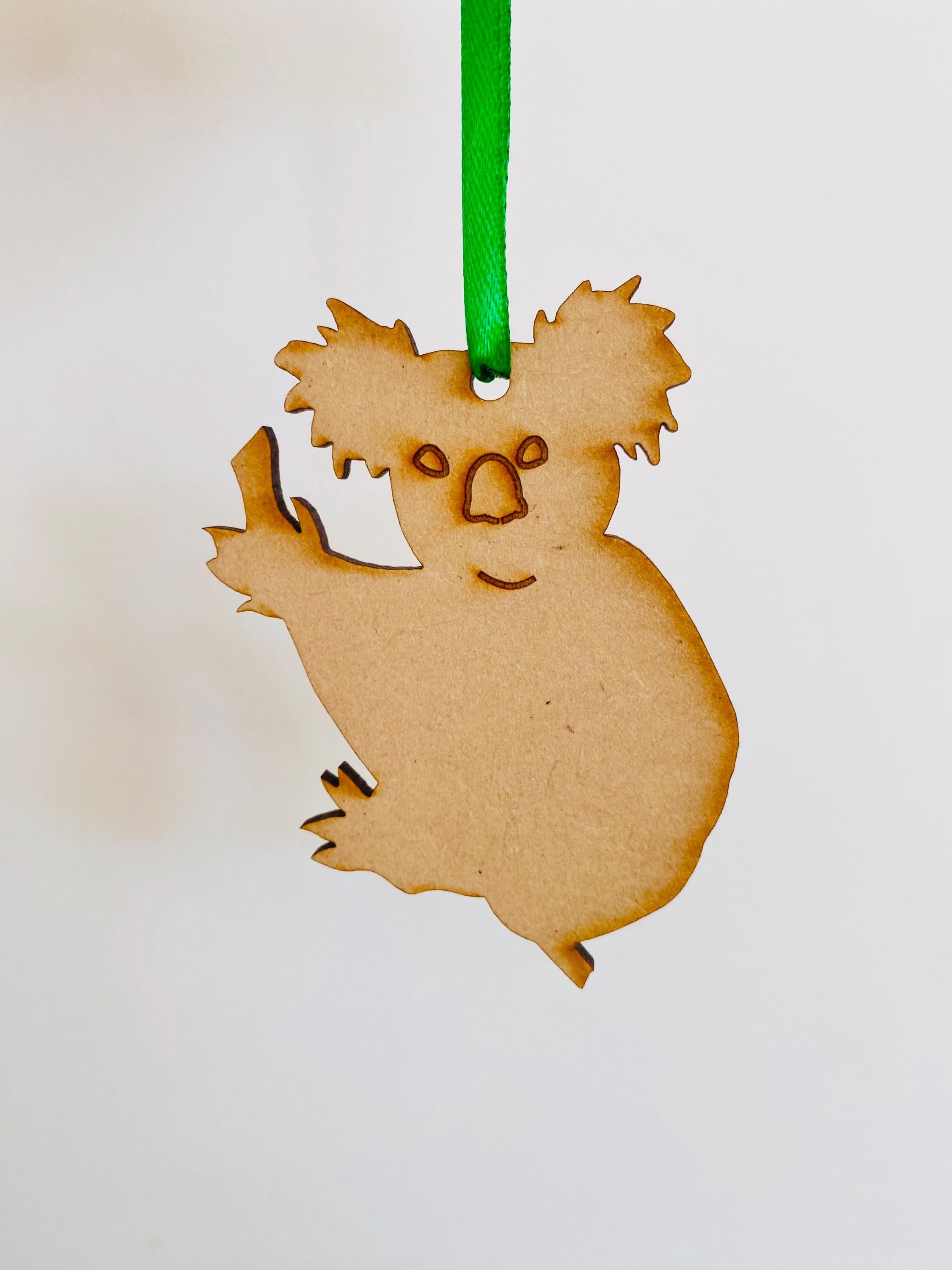 Koala Christmas Ornament: Wooden koala ornament for festive Australian-themed decor.