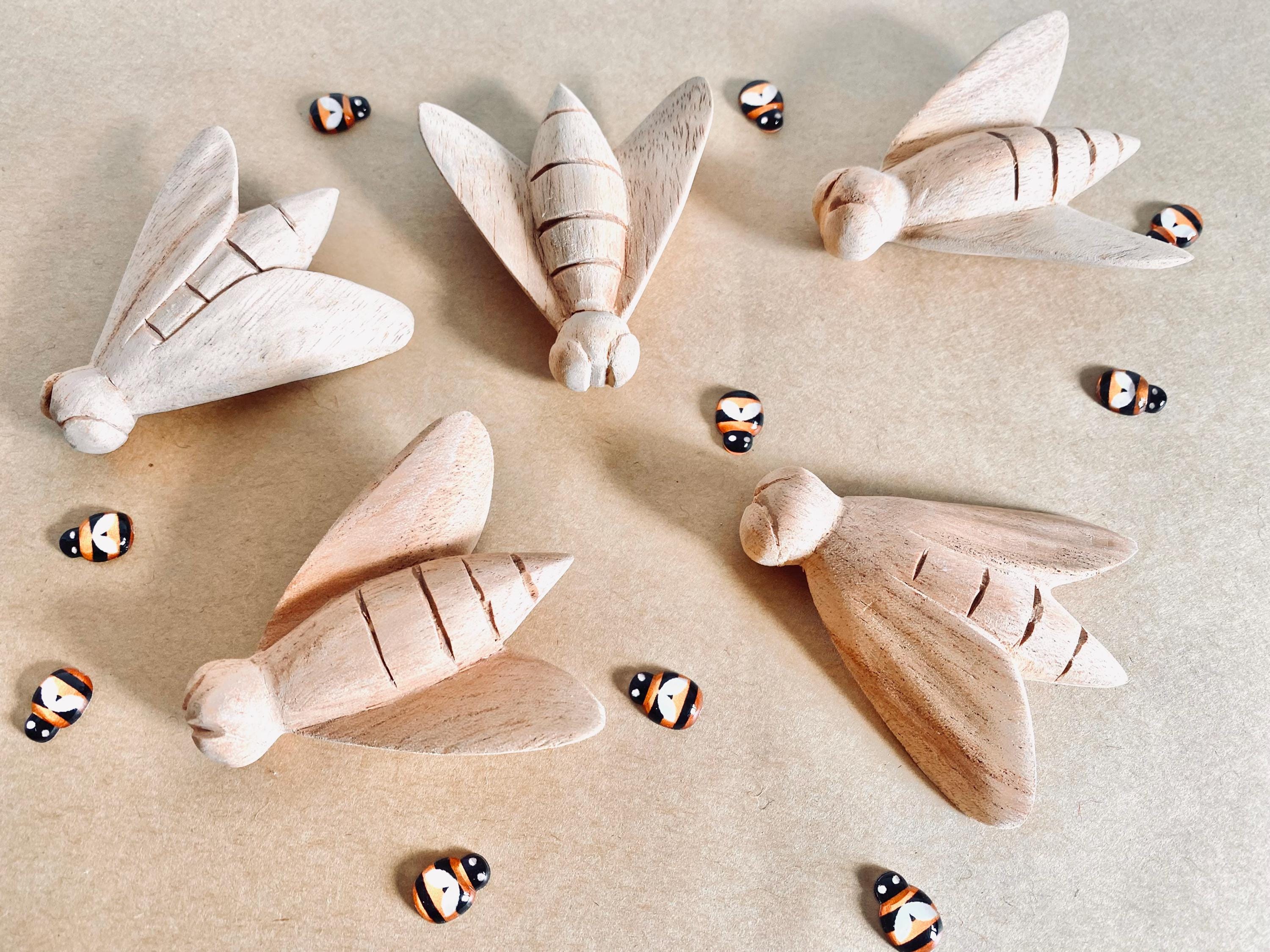 hand-carved wooden bees: large wooden bees for life cycle learning.