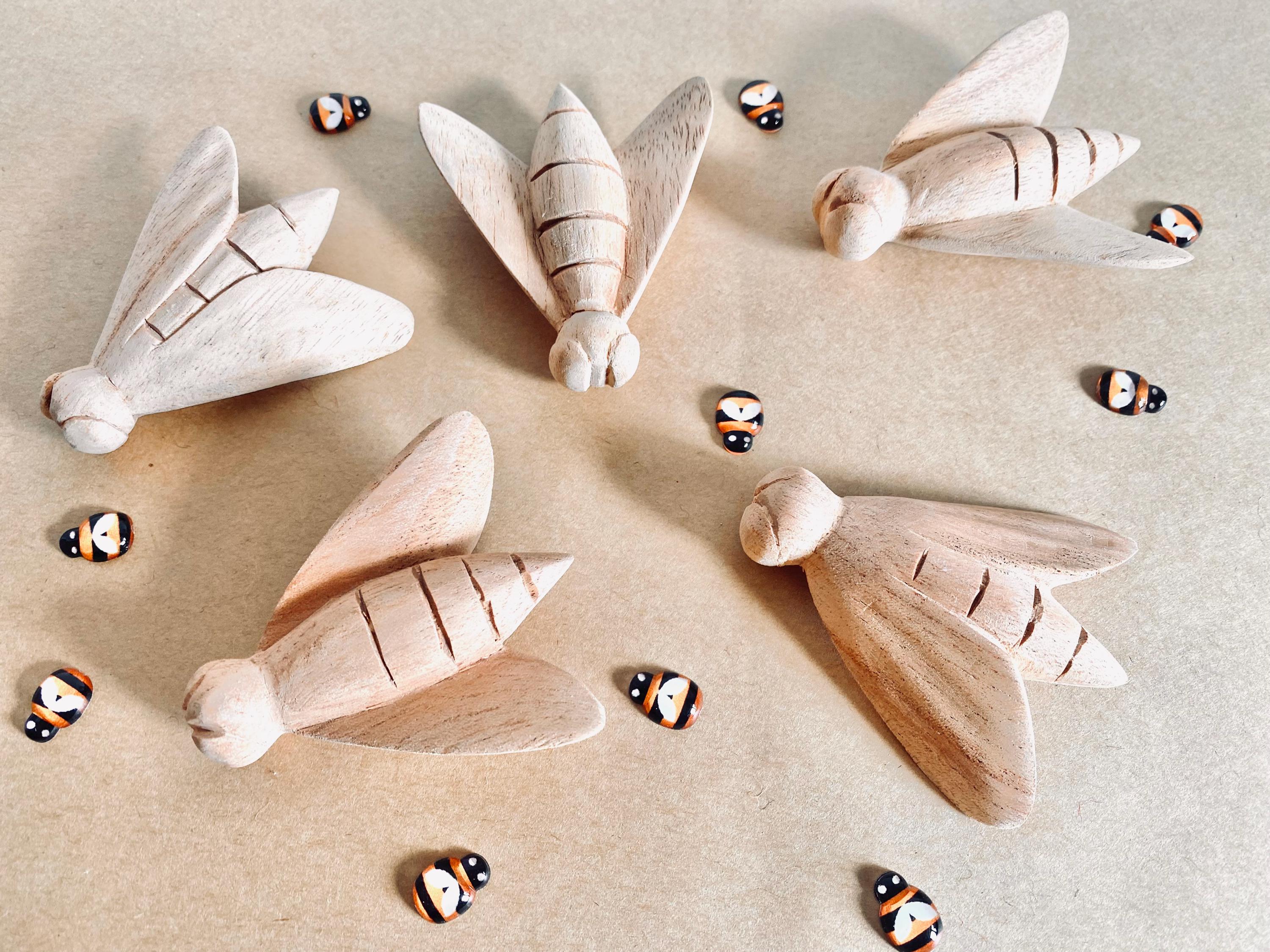 Hand-Carved Wooden Bees: Large wooden bees for life cycle learning.