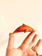 Eco-friendly 11cm wooden dolphin figurine, perfect as sustainable decor or a playful toy.