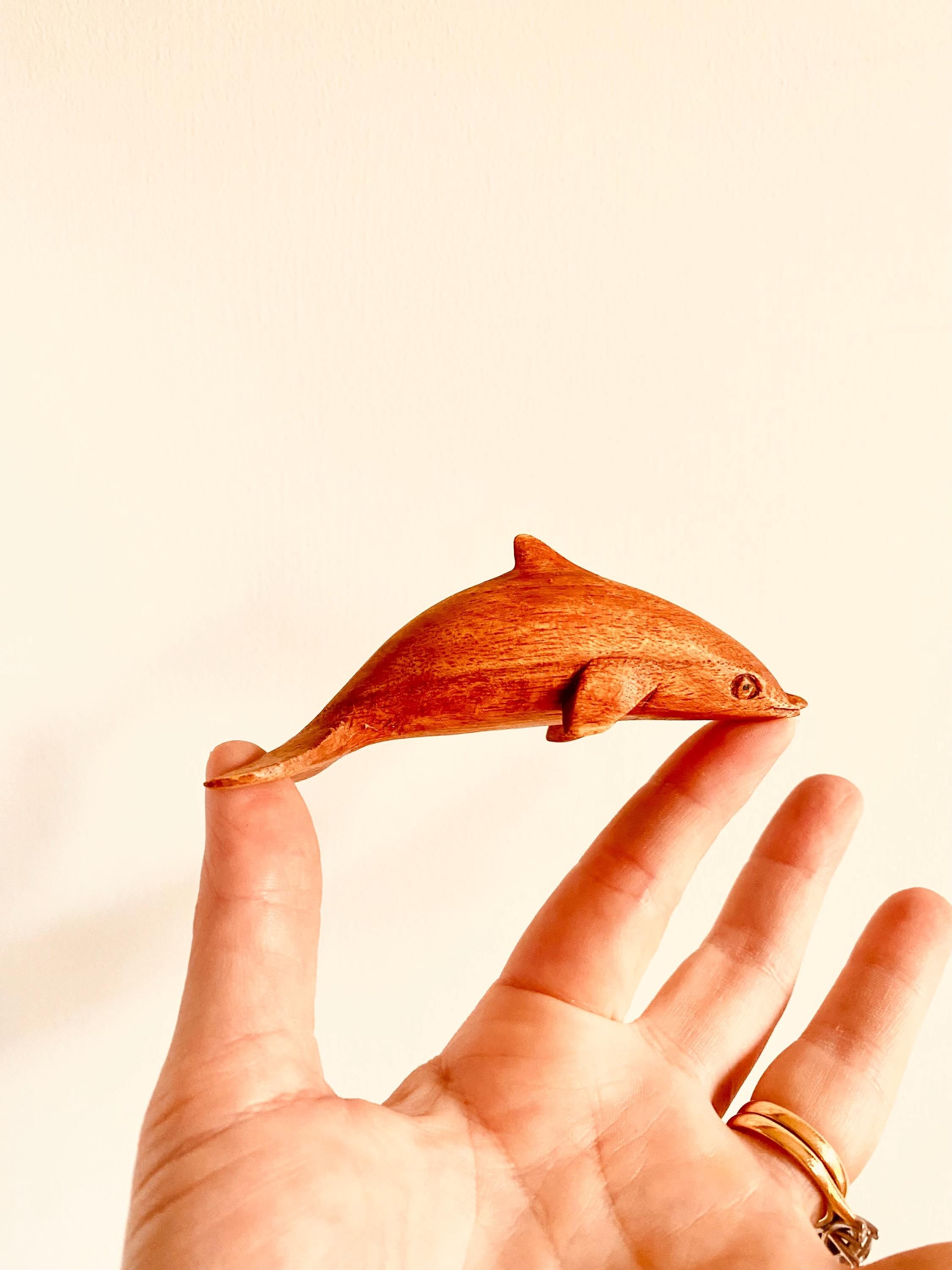 Eco-friendly 11cm wooden dolphin figurine, perfect as sustainable decor or a playful toy.